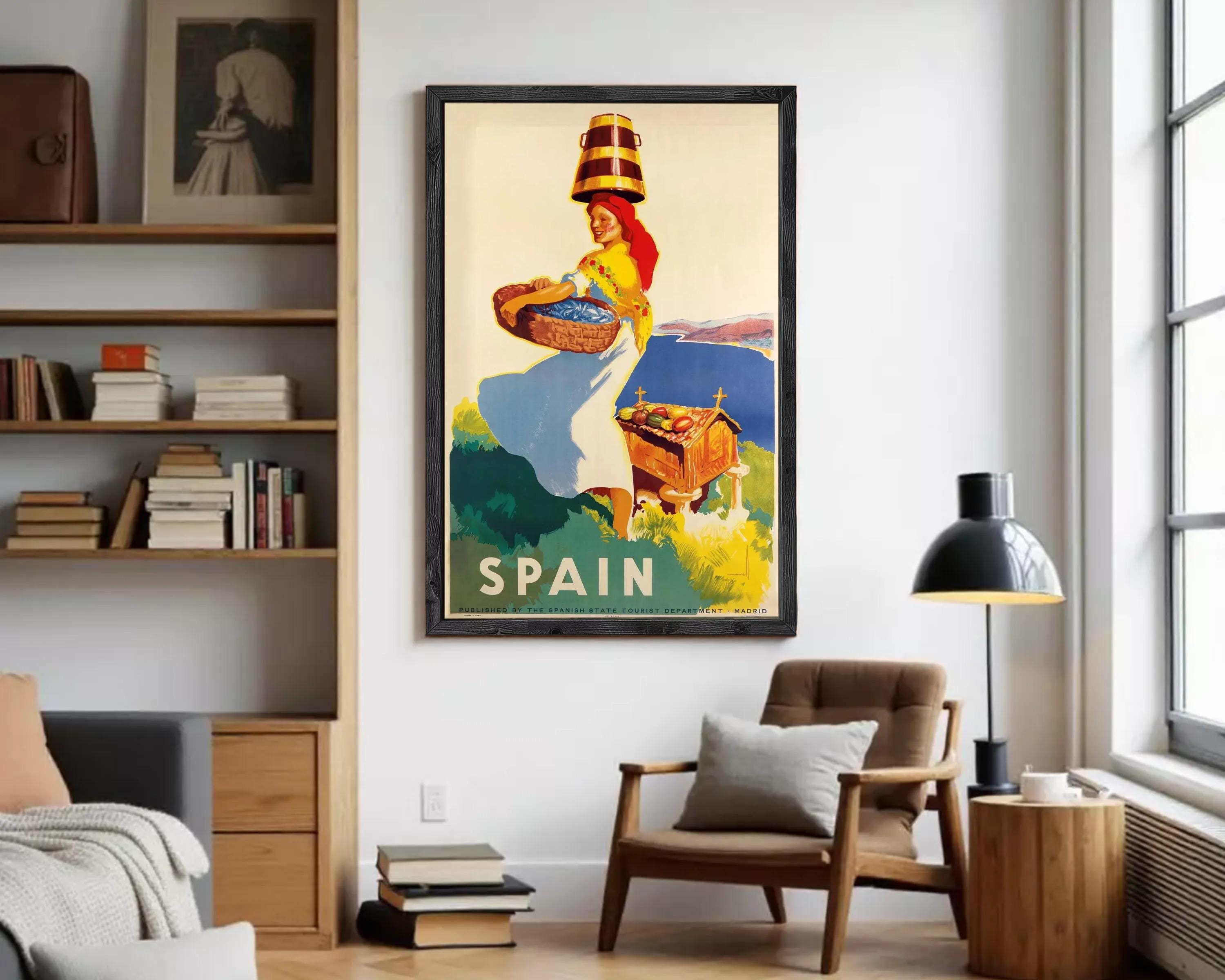 A framed vintage travel poster depicting a woman carrying a basket of fruit, with the word "SPAIN" prominently displayed.
