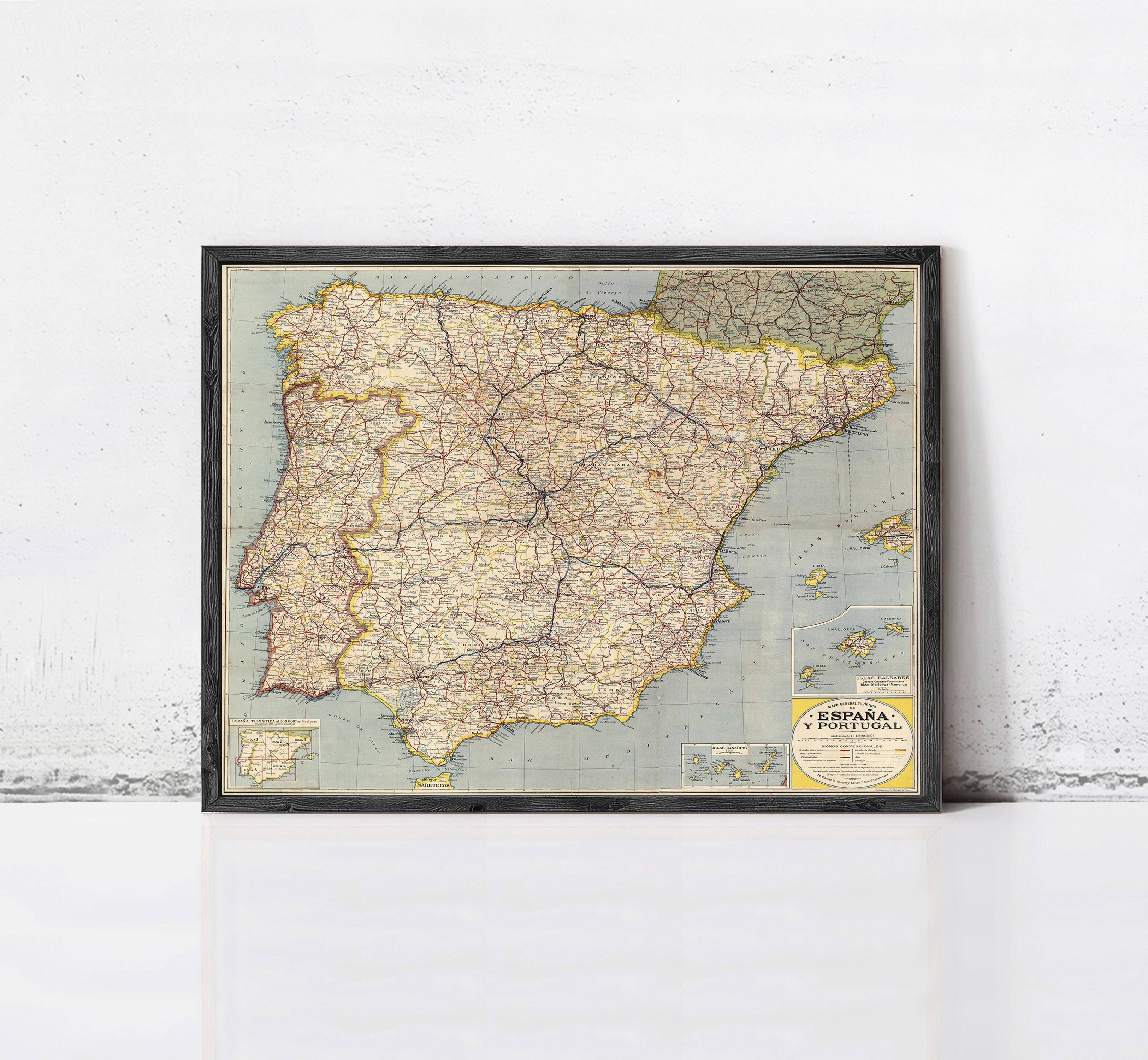 The image is a framed map of Spain, showing the country's geographical layout and major cities.