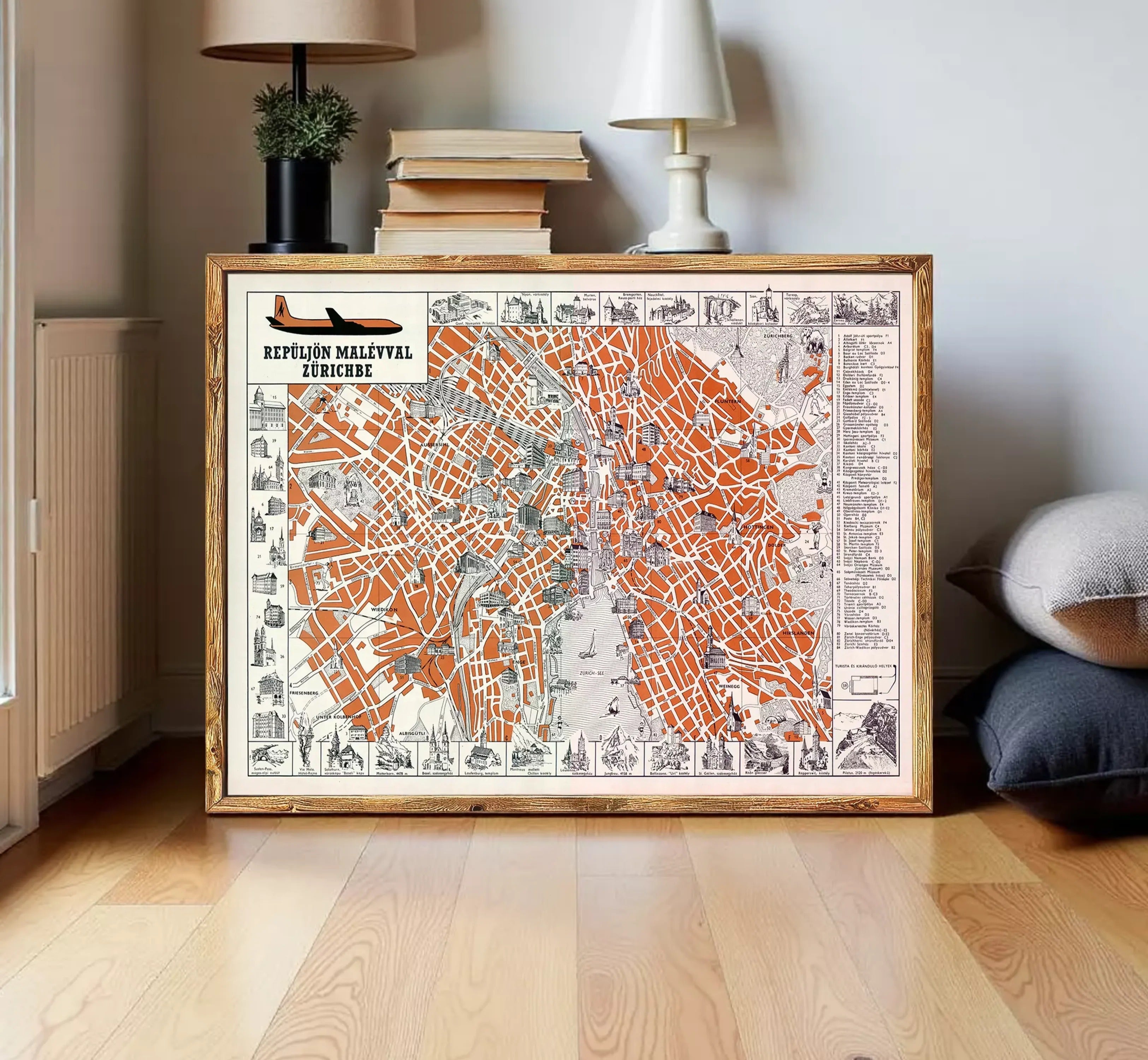 The image is a framed vintage map of the city of Zürich, Switzerland, depicting various landmarks and streets in a detailed and colorful manner.