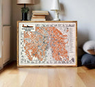 The image is a framed vintage map of the city of Zürich, Switzerland, depicting various landmarks and streets in a detailed and colorful manner.
