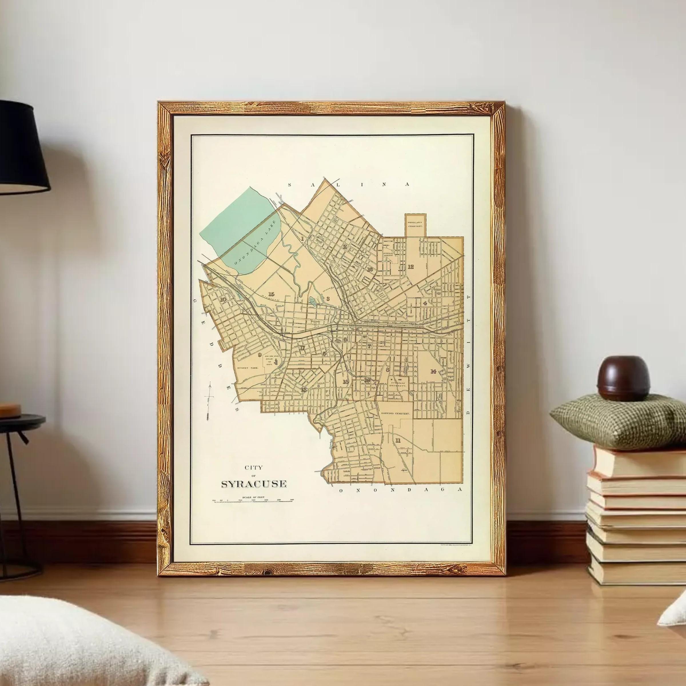 A framed map of the city of Syracuse, New York, with a vintage style and a wooden frame.