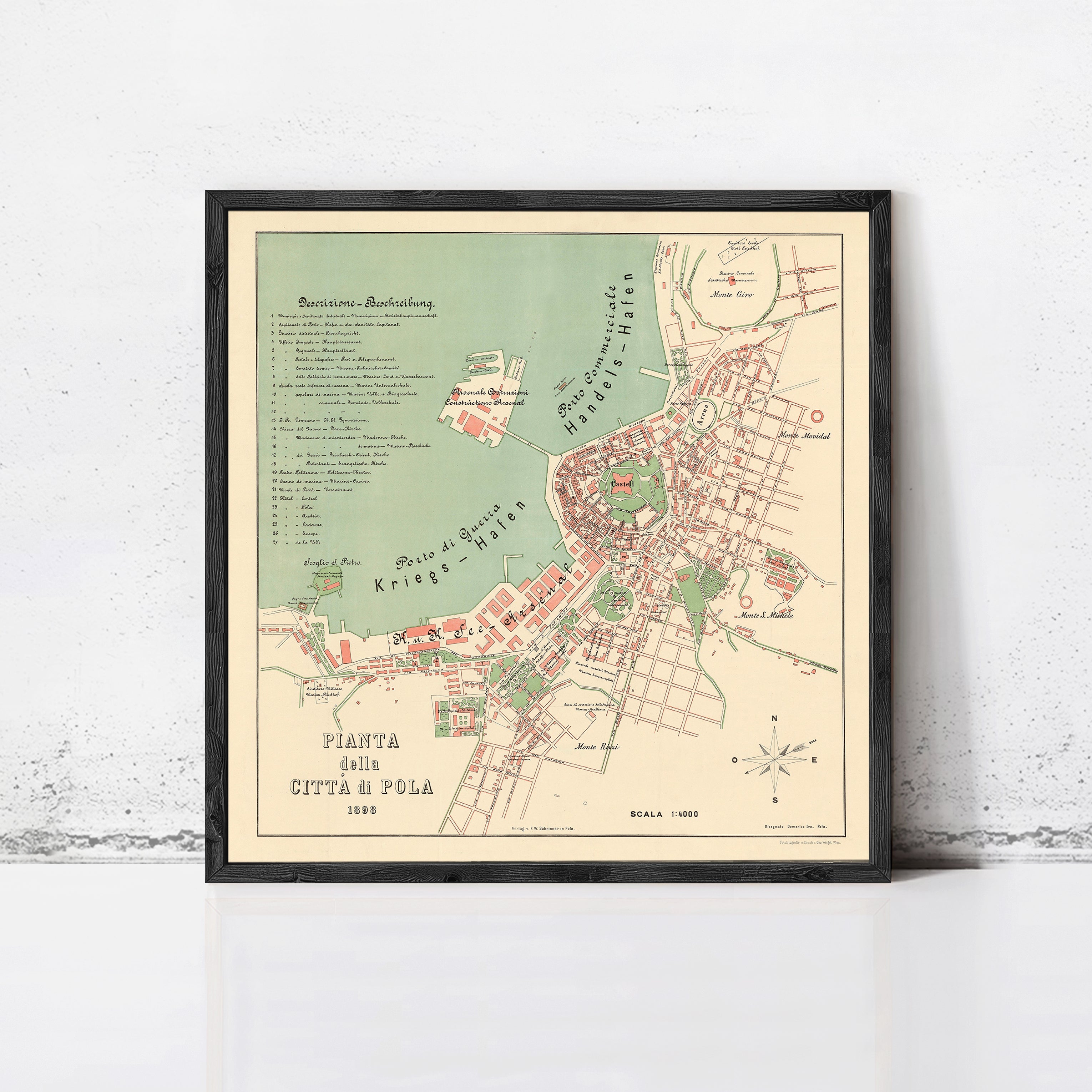 The image is a framed map of a city, depicting the streets, landmarks, and surrounding areas.