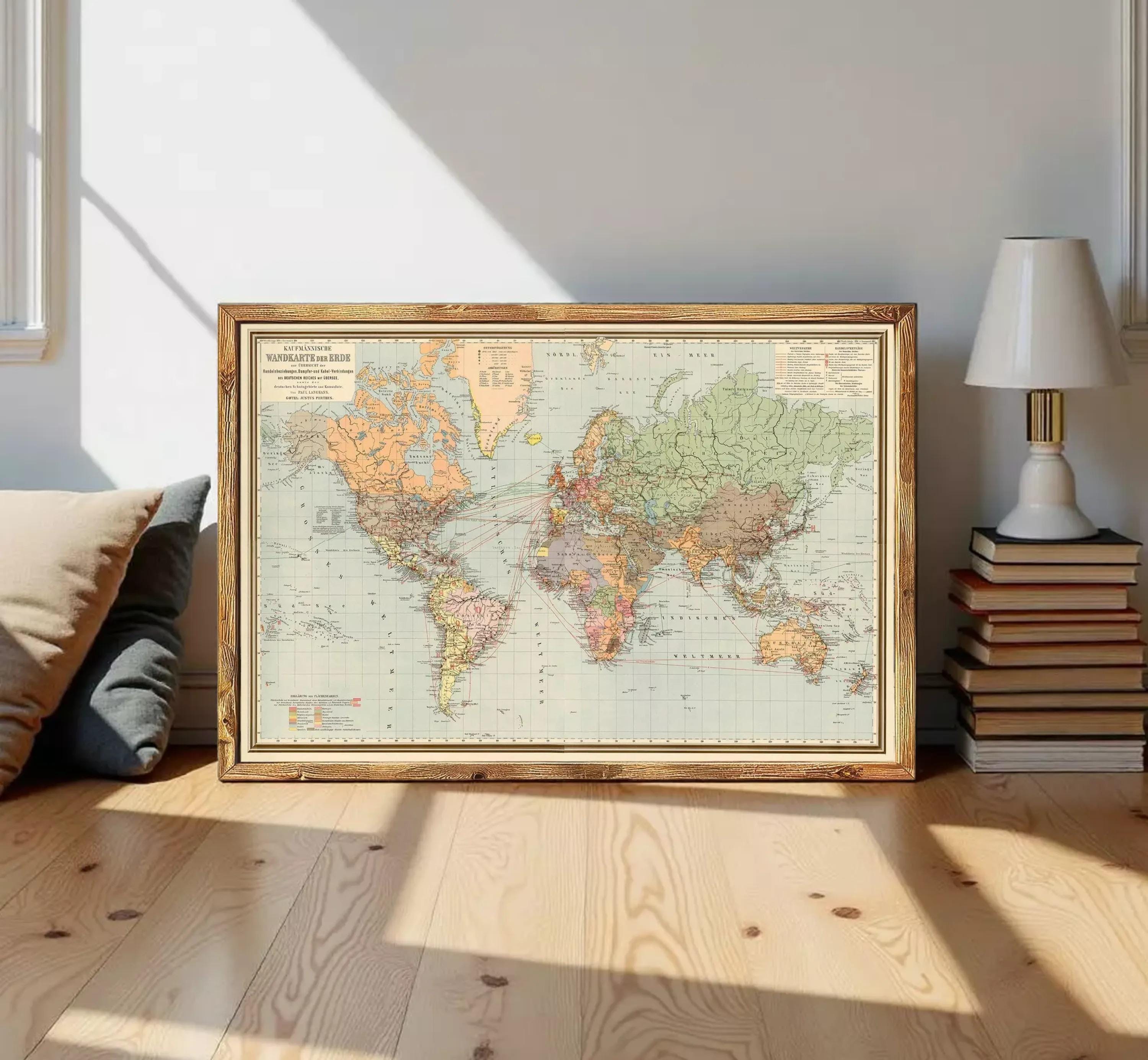 a framed vintage world map with a wooden frame, displayed on a white wall.