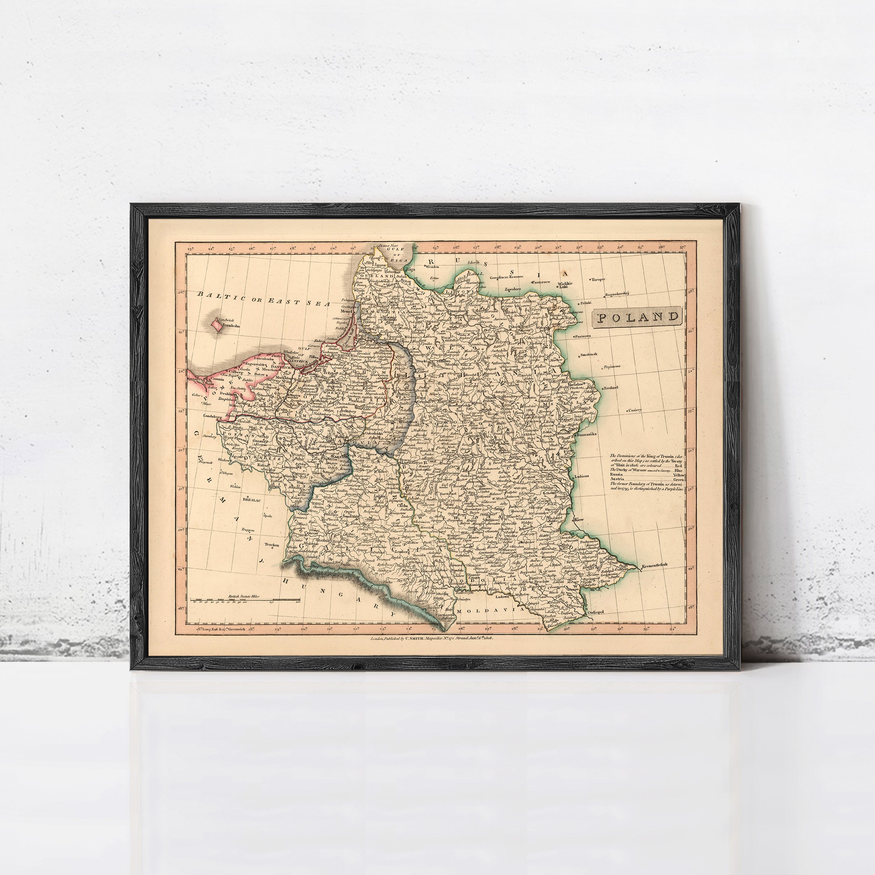 The image is a framed map of Poland, depicting the country's geographical layout and boundaries.