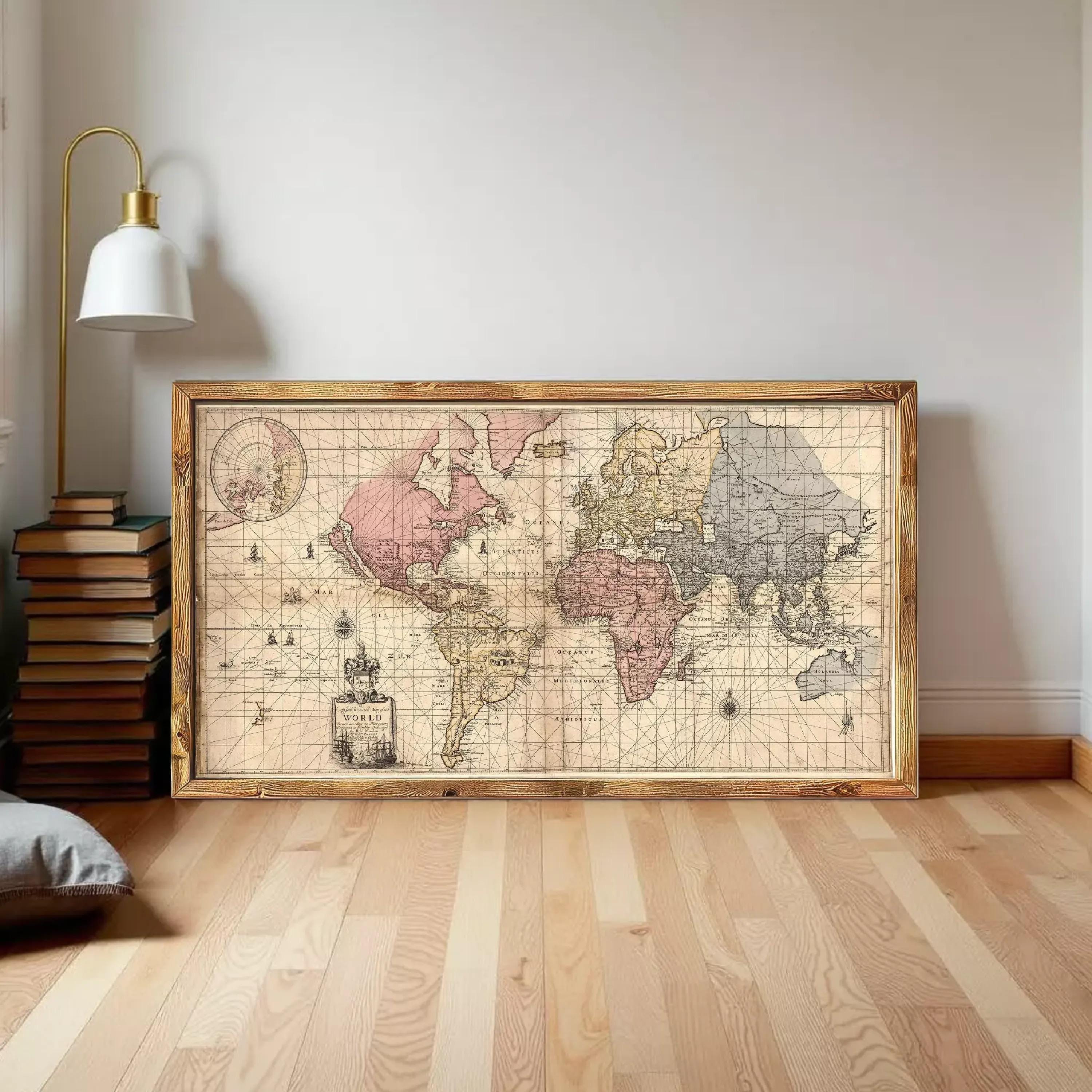 A framed vintage map of the world, depicting the continents and oceans in a detailed and intricate manner.