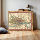The image is a framed vintage map of London, England, depicting the city's streets, landmarks, and surrounding areas.