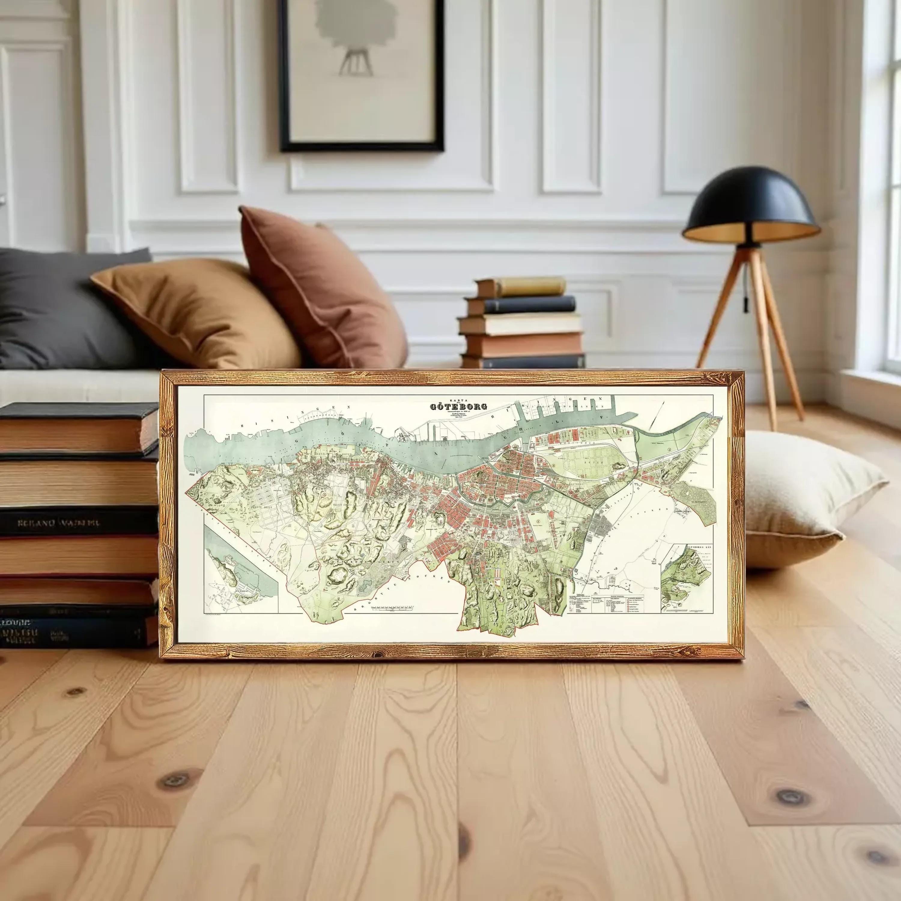 The image is a framed map of a city, likely a historical or geographical map, displayed on a white wall.