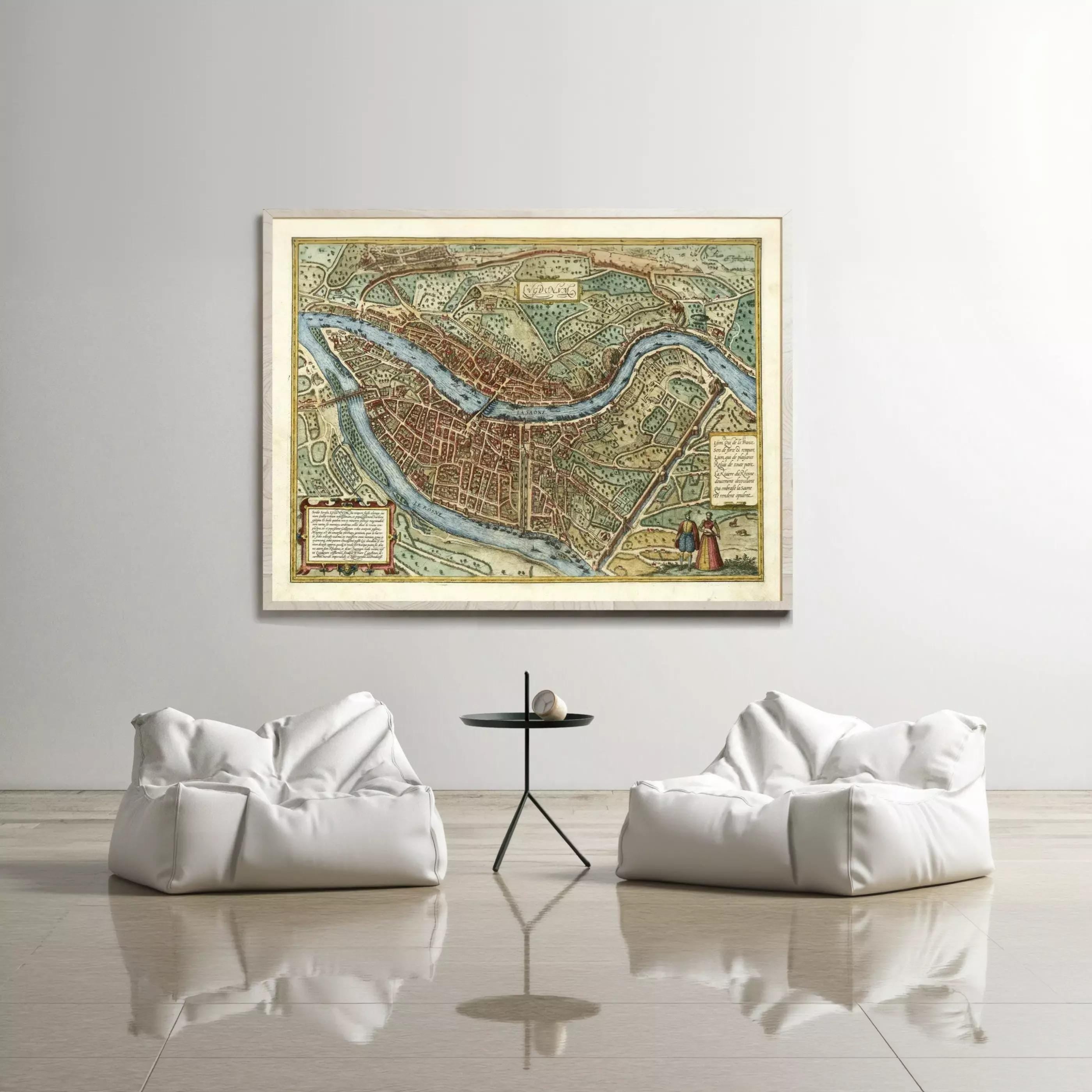 a large, antique map of a city hanging on a wall, with two white bean bag chairs positioned in front of it.