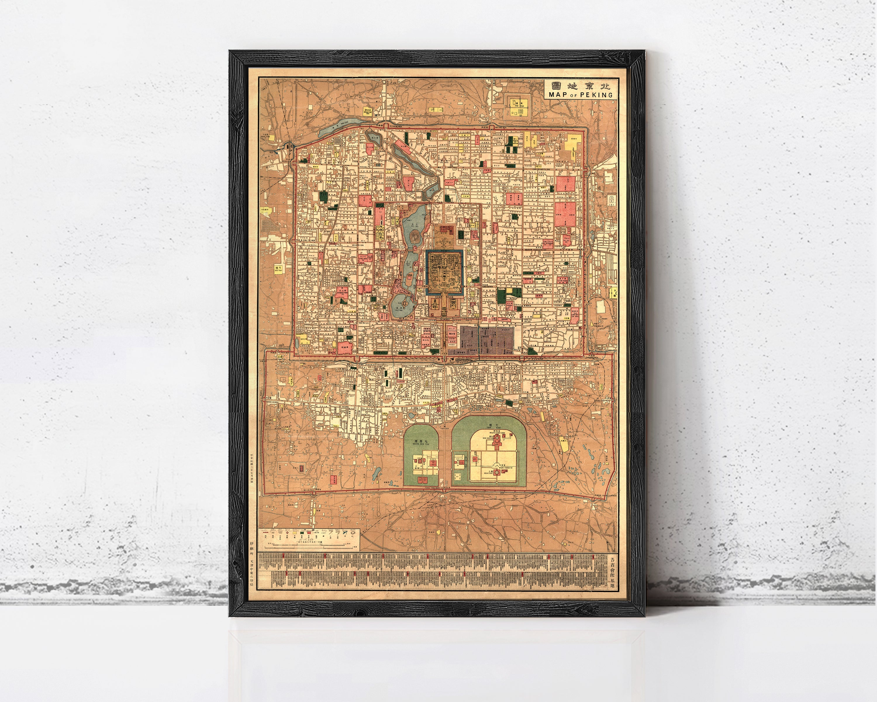 The image is a framed antique map of a city, likely from the 19th century, with intricate details and a vintage appearance.