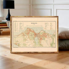 a framed map of Reykjavik, Iceland, with a wooden frame and a vintage-style map design.