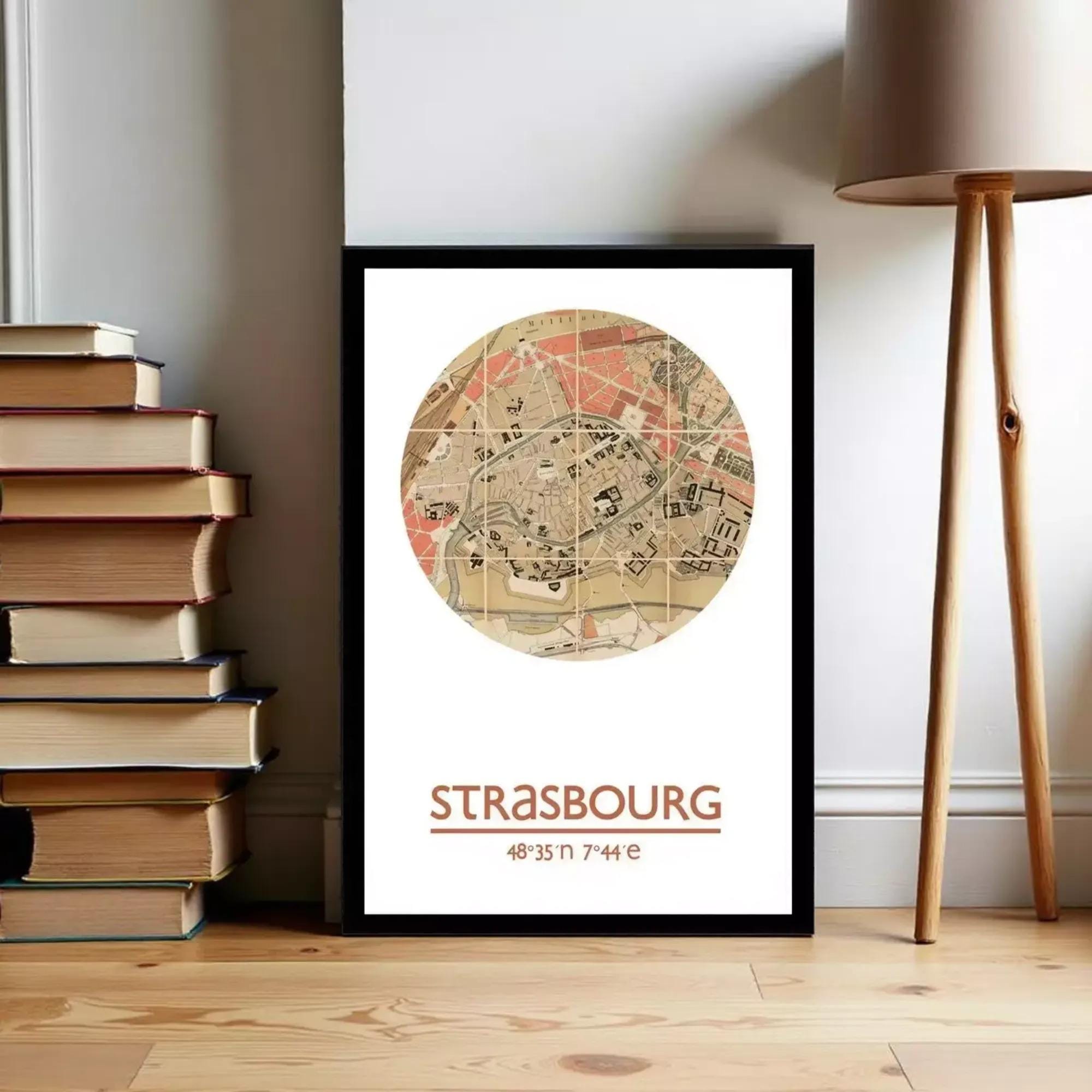 A framed map of Strasbourg, France, with the text "STRASBOURG 48°33'11" 7°44" displayed on it.