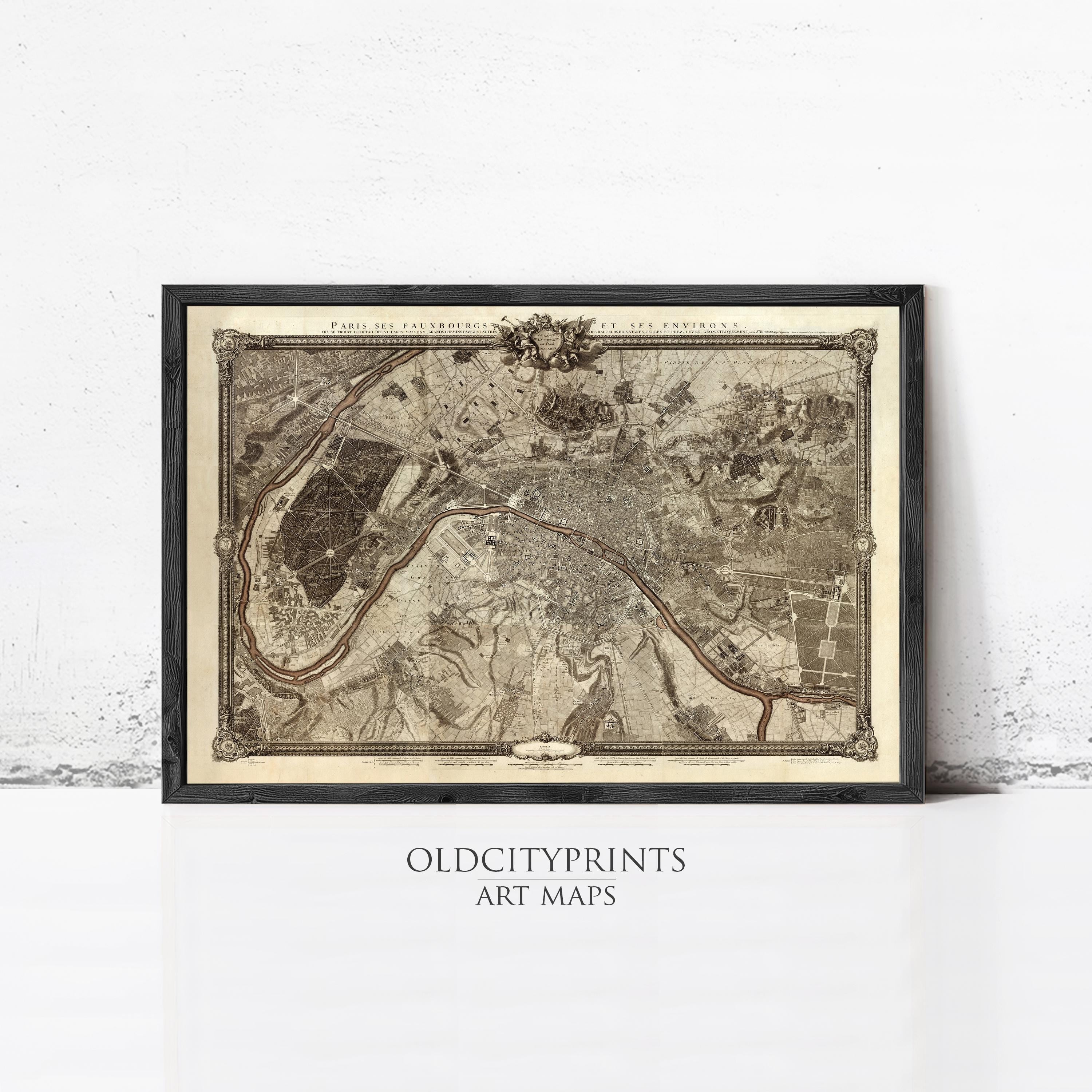 The image is a framed vintage map of Paris, France, depicting the city's streets and surrounding areas.