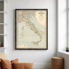 The image is a framed vintage map of Italy, showing the country's geographical layout and surrounding areas.