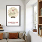 a framed poster of a map of Philadelphia hanging on a wall in a living room.