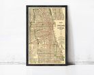 The image is a framed vintage map of Chicago, Illinois, depicting the city's streets and transportation system.
