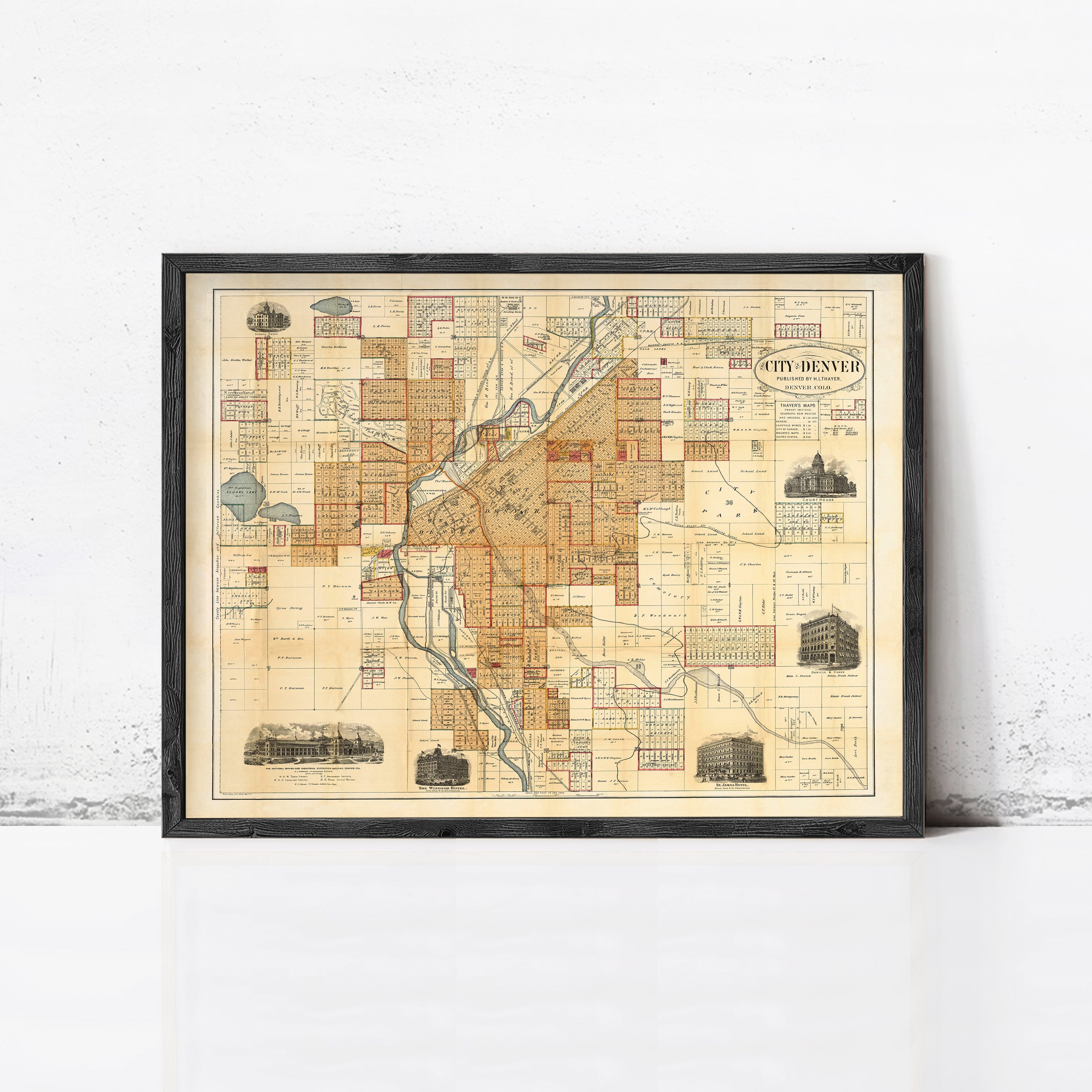 The image is a framed vintage map of the city of Denver, Colorado, depicting various landmarks and streets.