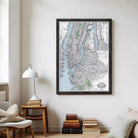 The image is a framed map of New York City, depicting the city's streets, waterways, and surrounding areas.