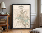 The image is a framed map of the city of canberra, Australia, depicting the city's layout and surrounding areas.