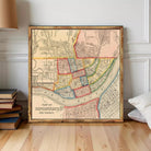 A framed vintage map of Cincinnati, Ohio, depicting the city's layout and surrounding areas.