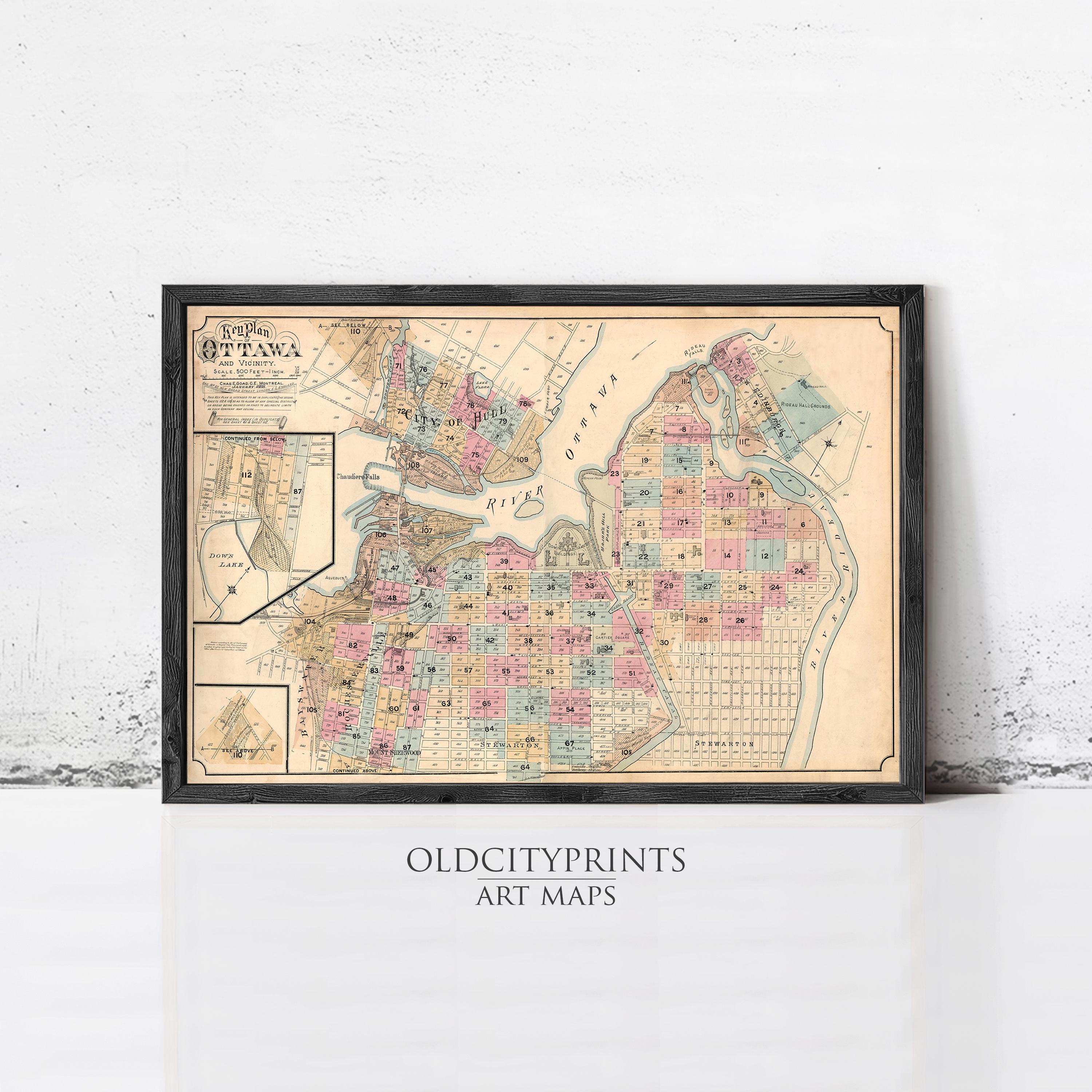 The image is a framed vintage map of a city, likely from the late 19th century, with a black border and a white background.