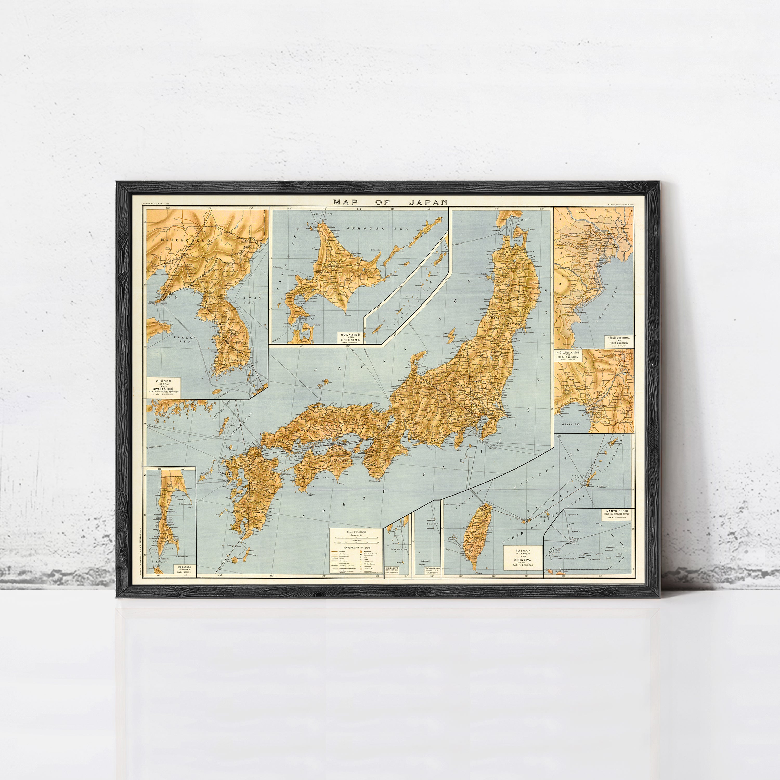 The image is a framed vintage map of Japan, depicting the country's geographical layout and surrounding areas.