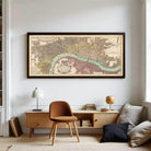 A framed historical map of London, featuring a detailed illustration of the city's streets, landmarks, and waterways.