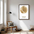a cozy living room with a wooden chair, a lamp, and a framed map of Dallas hanging on the wall.