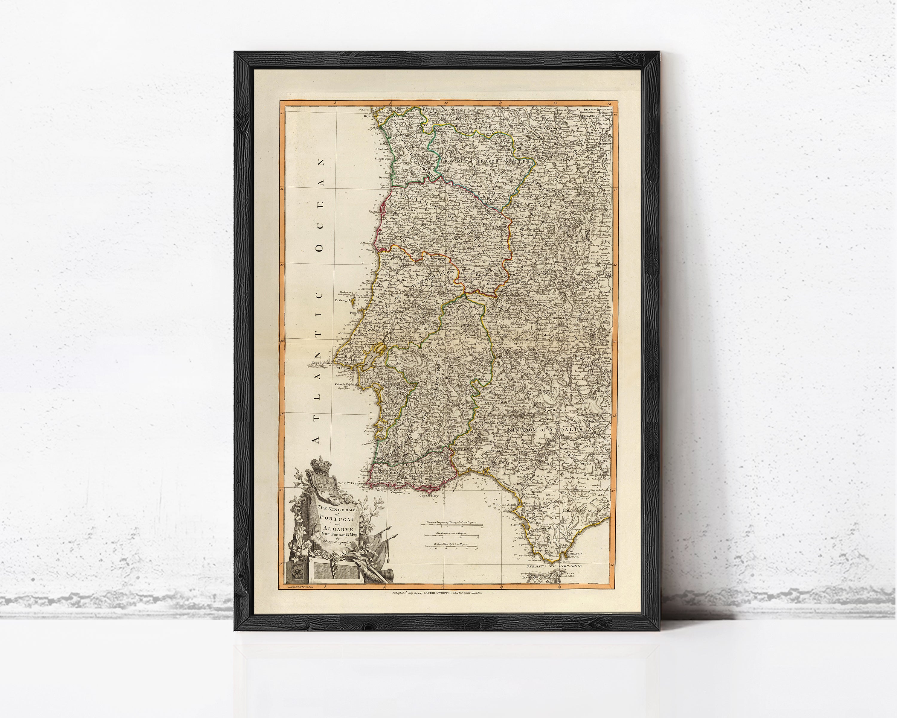The image is a framed antique map of Portugal, featuring detailed geographical information and a color scheme of various shades of brown and green.