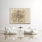 a large map of Brussels, Belgium, hanging on a white wall above a pair of white bean bag chairs and a small black table.