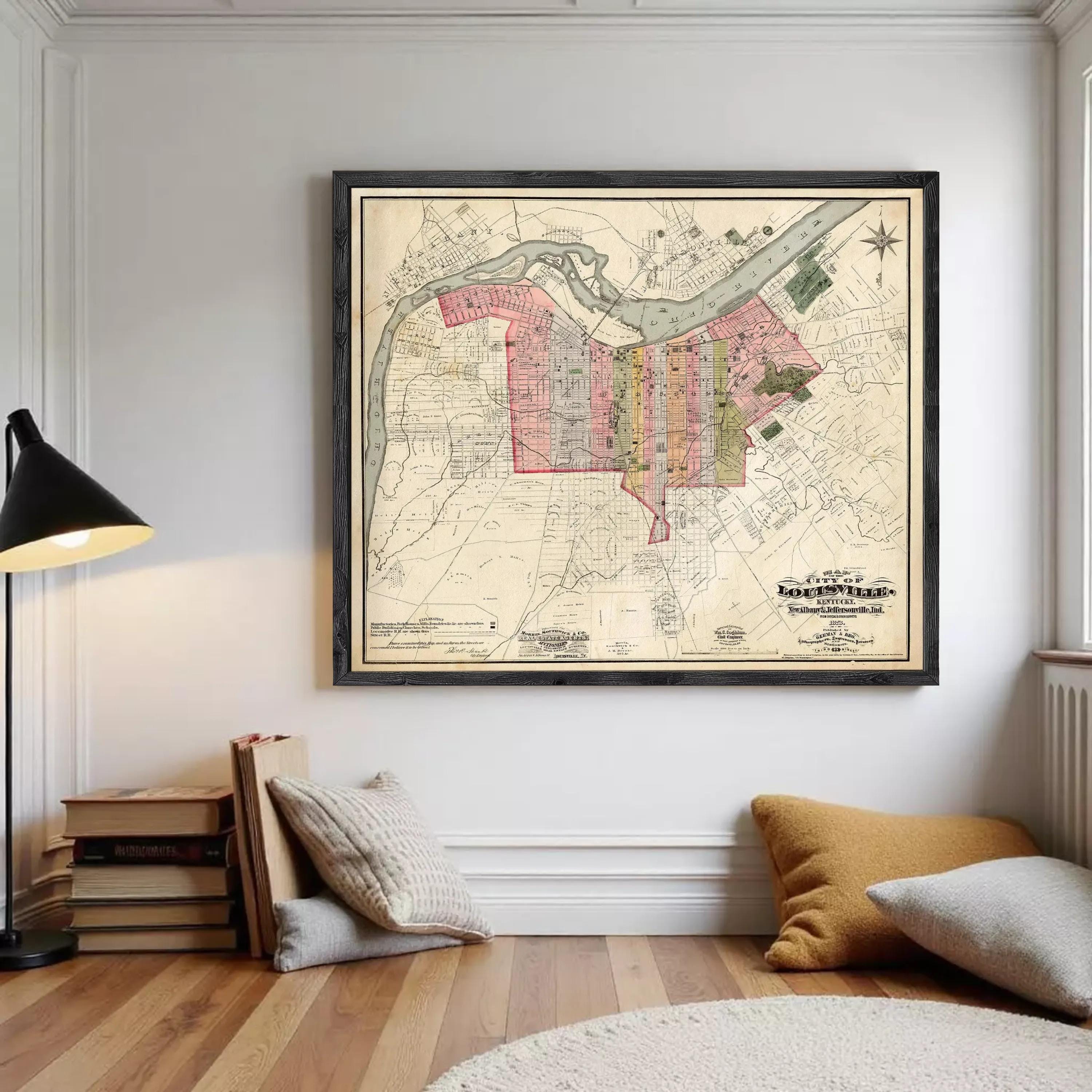 The image is a framed map of a city, likely from the early 20th century, depicting the layout and streets of the area.