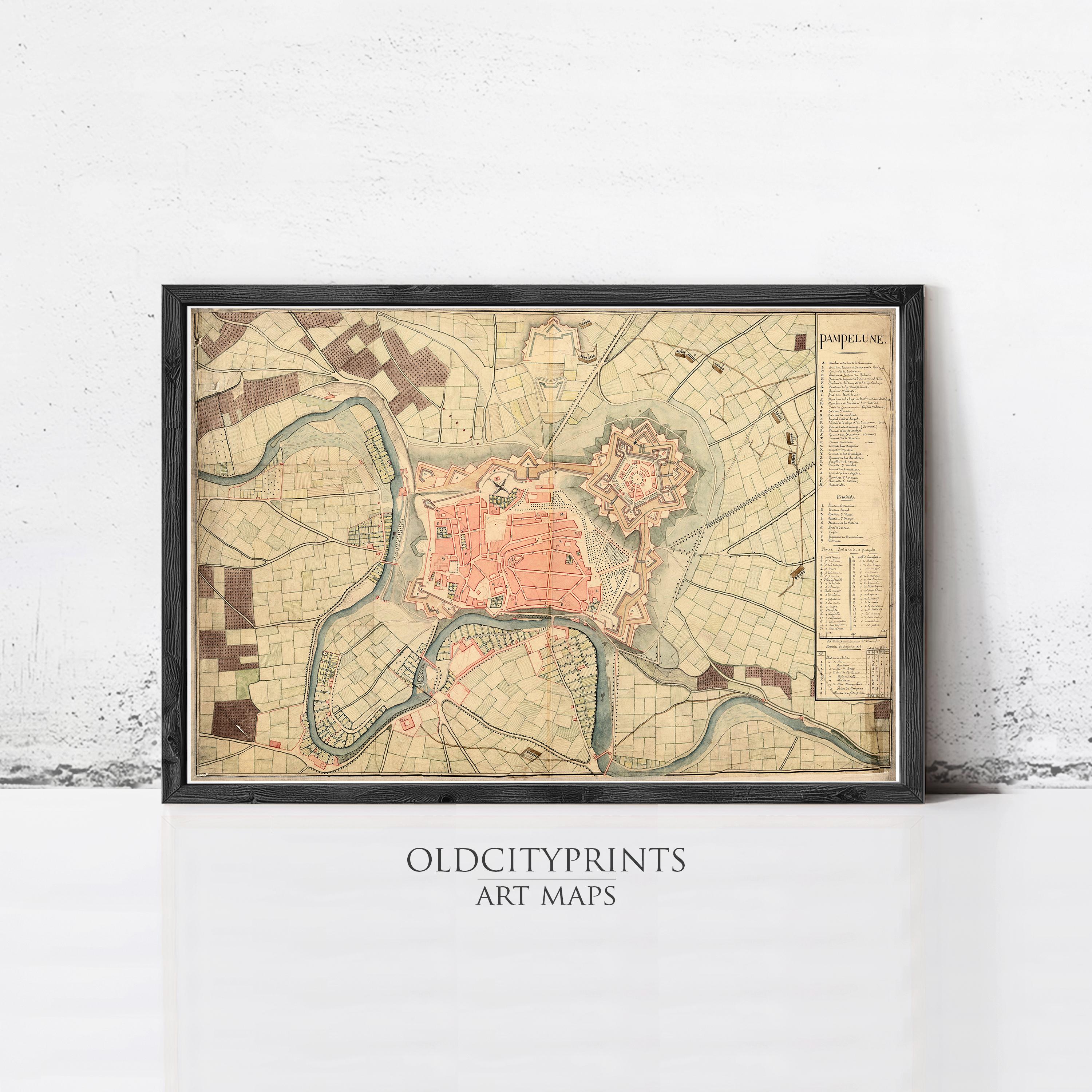 The image is a framed vintage map of a city, likely from the past, with various landmarks and streets depicted.