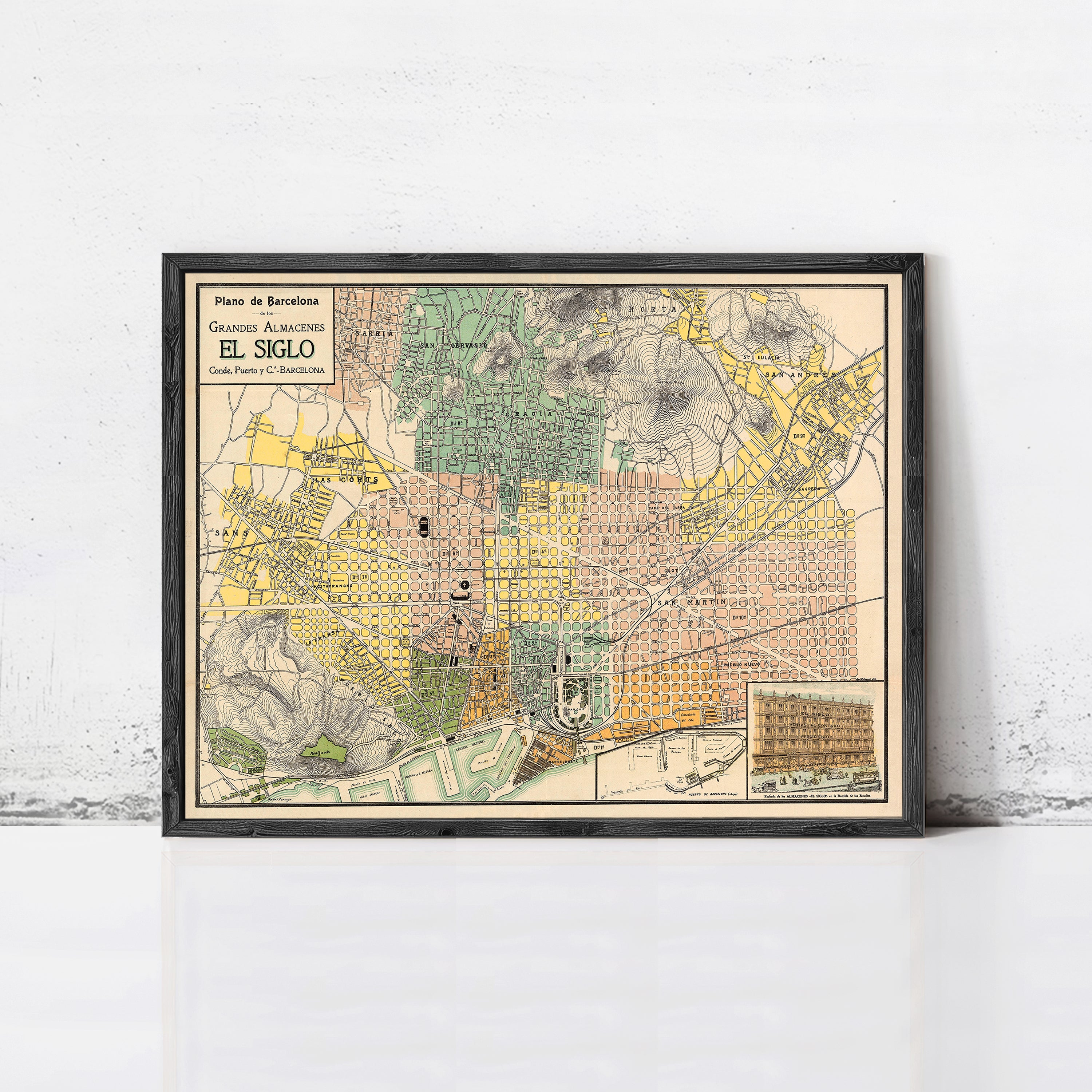 The image is a framed vintage map of Barcelona, Spain, depicting the city's streets, landmarks, and surrounding areas.