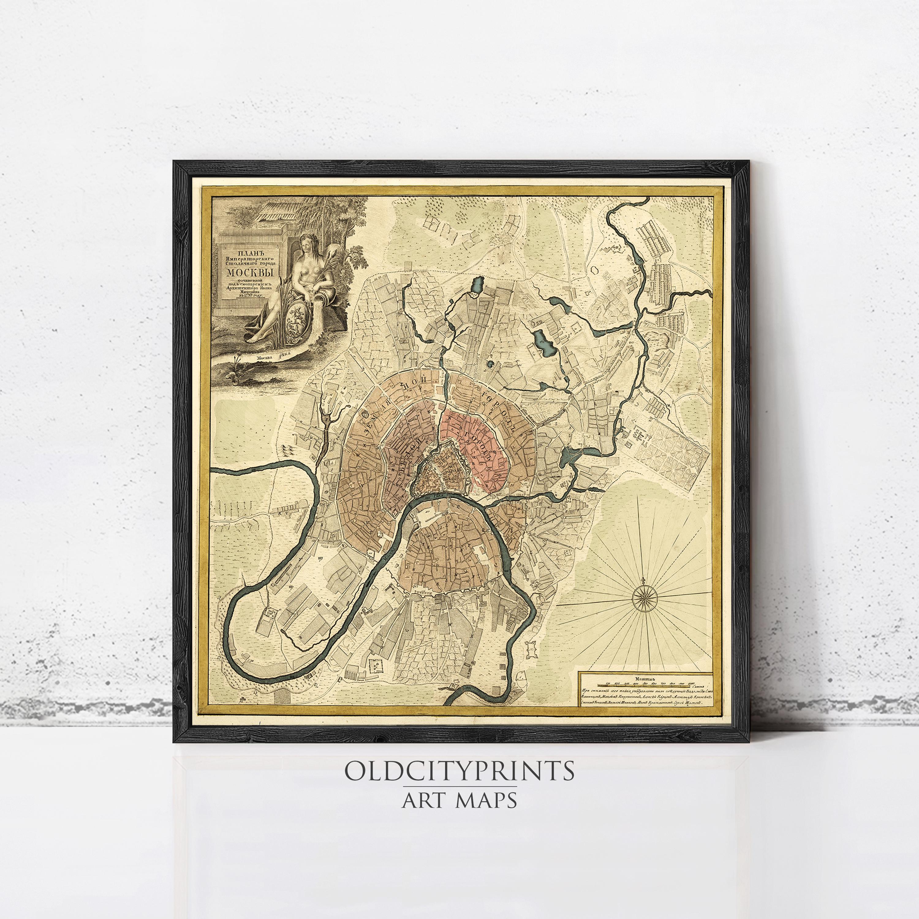 The image is a framed vintage map of a city, likely from the 18th century, with intricate details and a detailed layout.