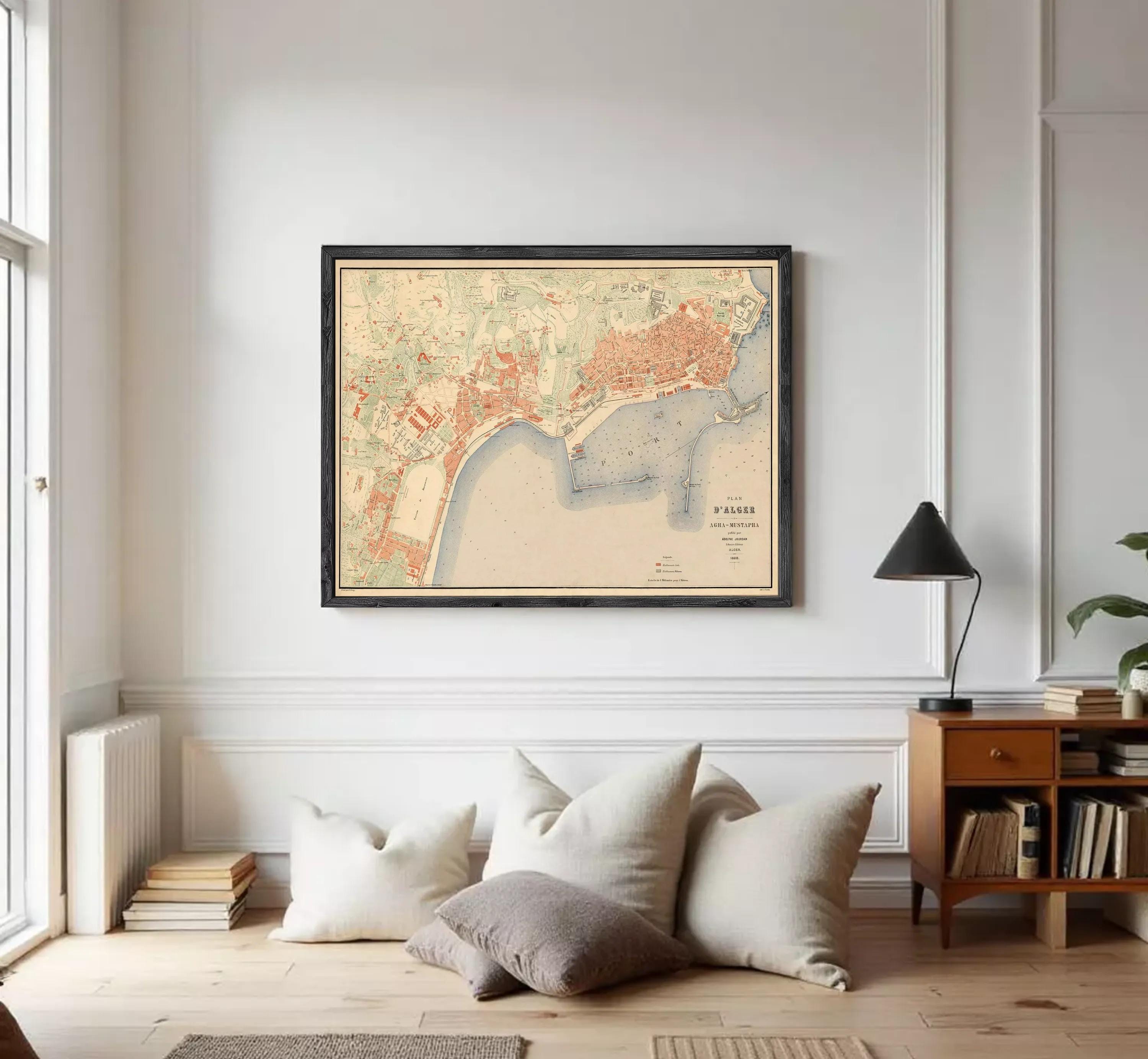 The image is a framed vintage map of a city, likely from the early 20th century, depicting the city's layout and surrounding areas.