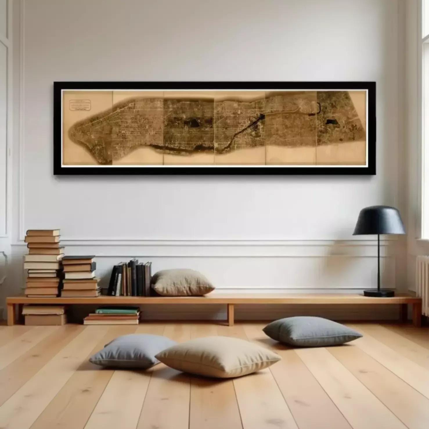 The image is a framed map of a large area, displayed on a wall.
