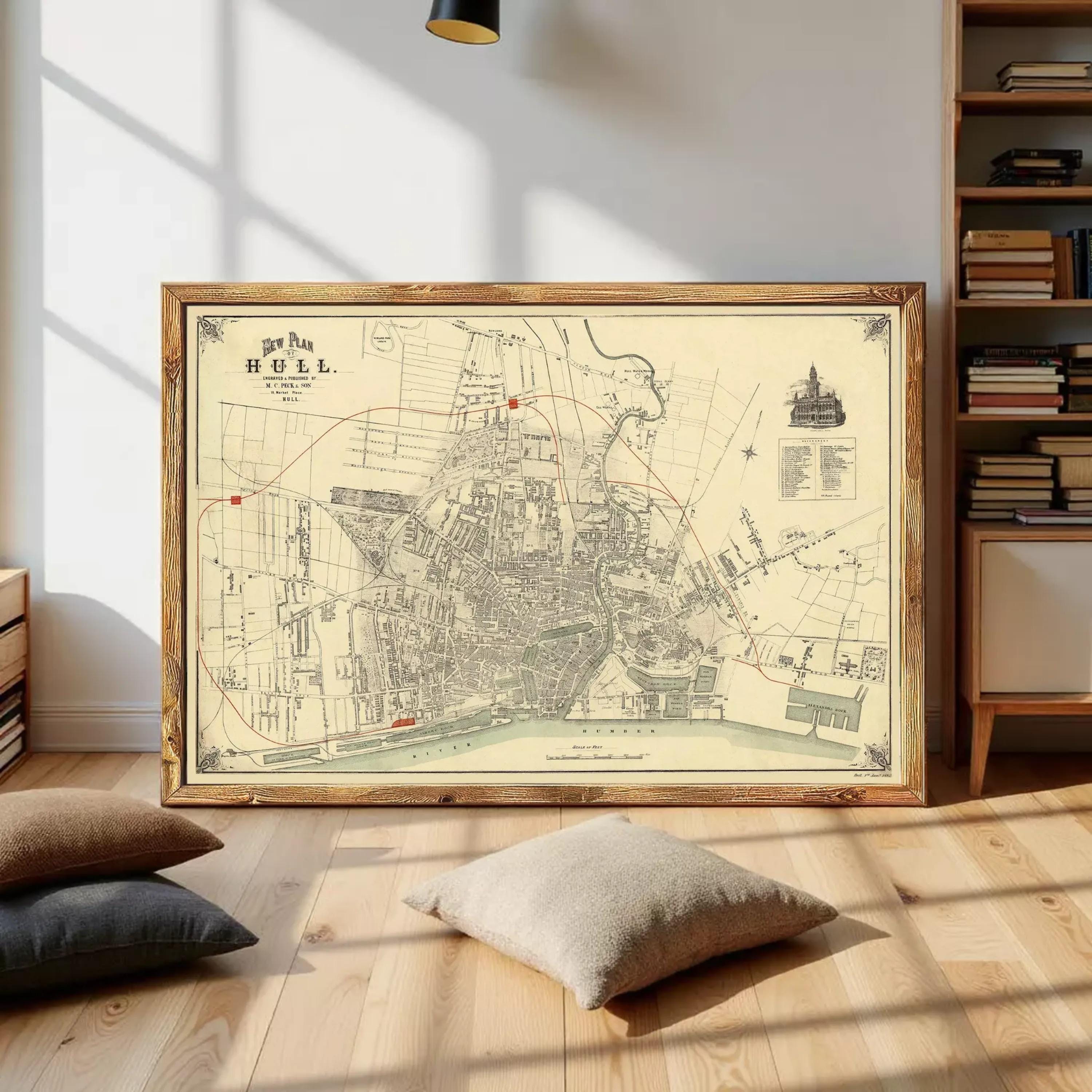 The image is a framed vintage map of a city, likely from the 19th century, depicting a detailed layout of streets, buildings, and other urban features.