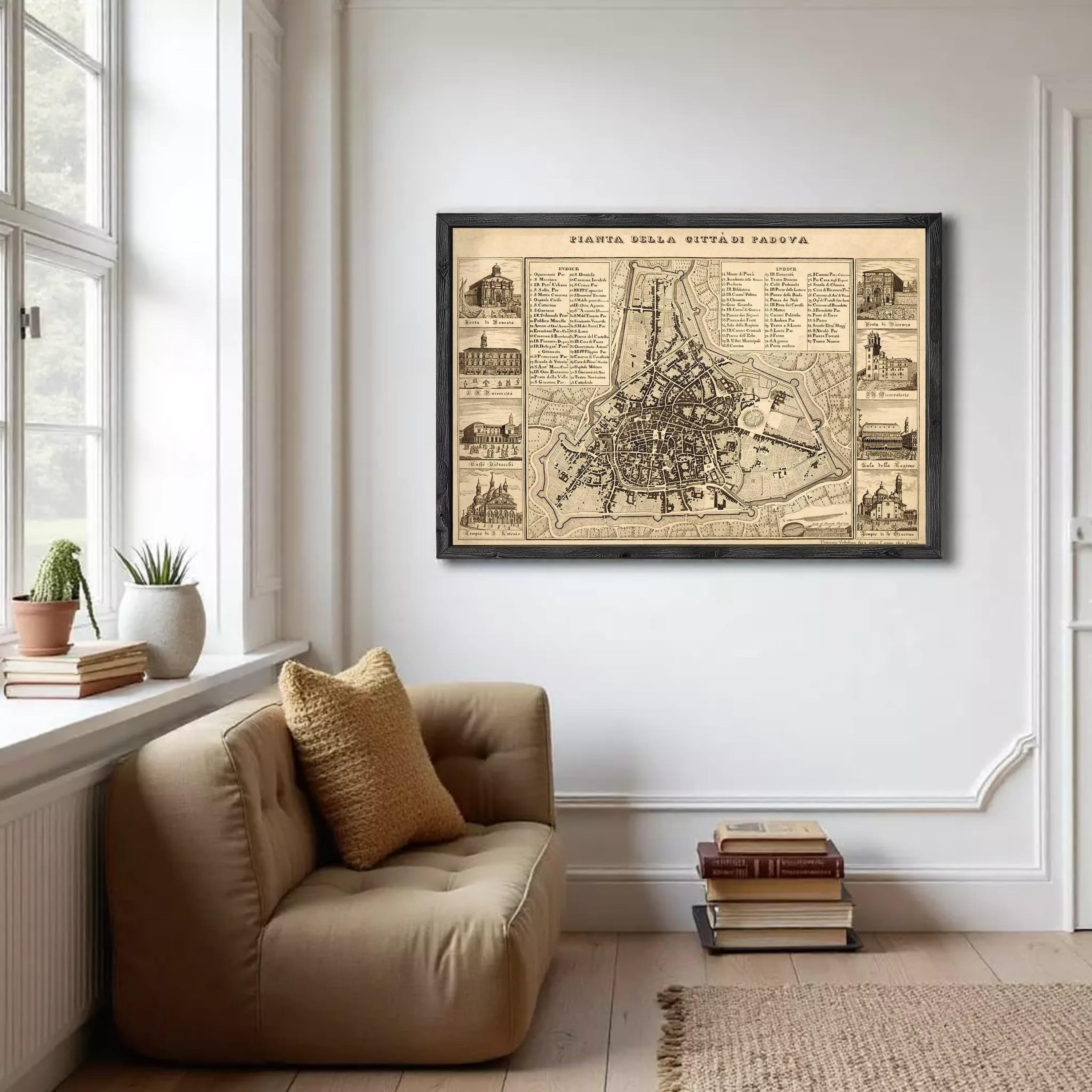 a large framed map of a city hanging on a white wall in a living room.