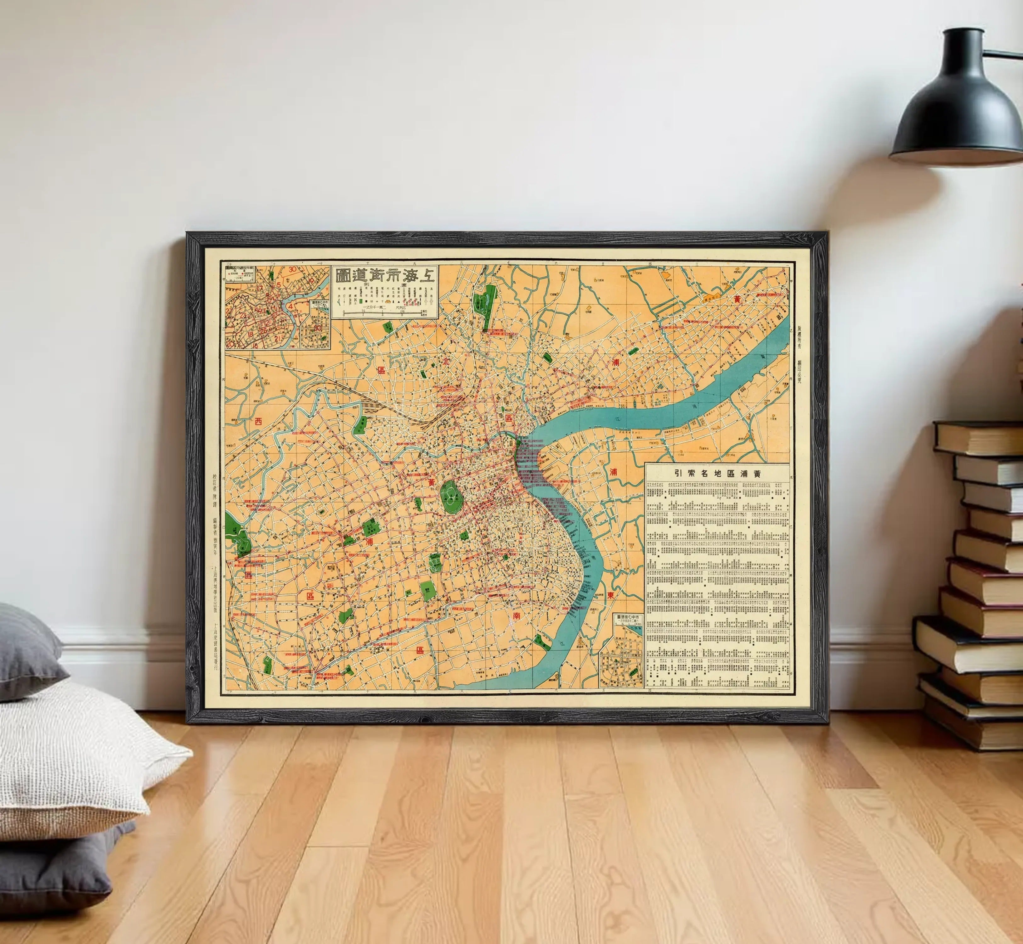The image is a framed vintage map of a city, likely from the early 20th century, with a focus on the urban layout and surrounding areas.