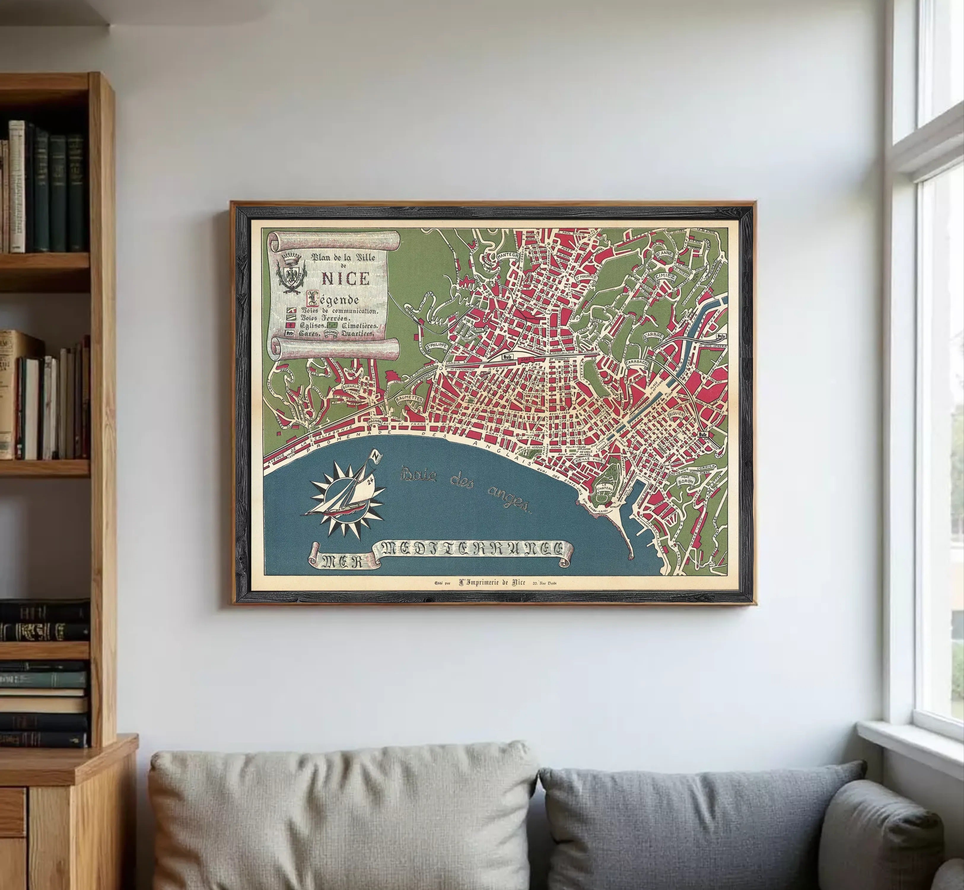 The image is a framed vintage map of Nice, France, depicting the city's layout and surrounding areas.