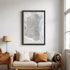 The image is a framed map of Philadelphia, Pennsylvania, depicting the city's streets, landmarks, and surrounding areas.