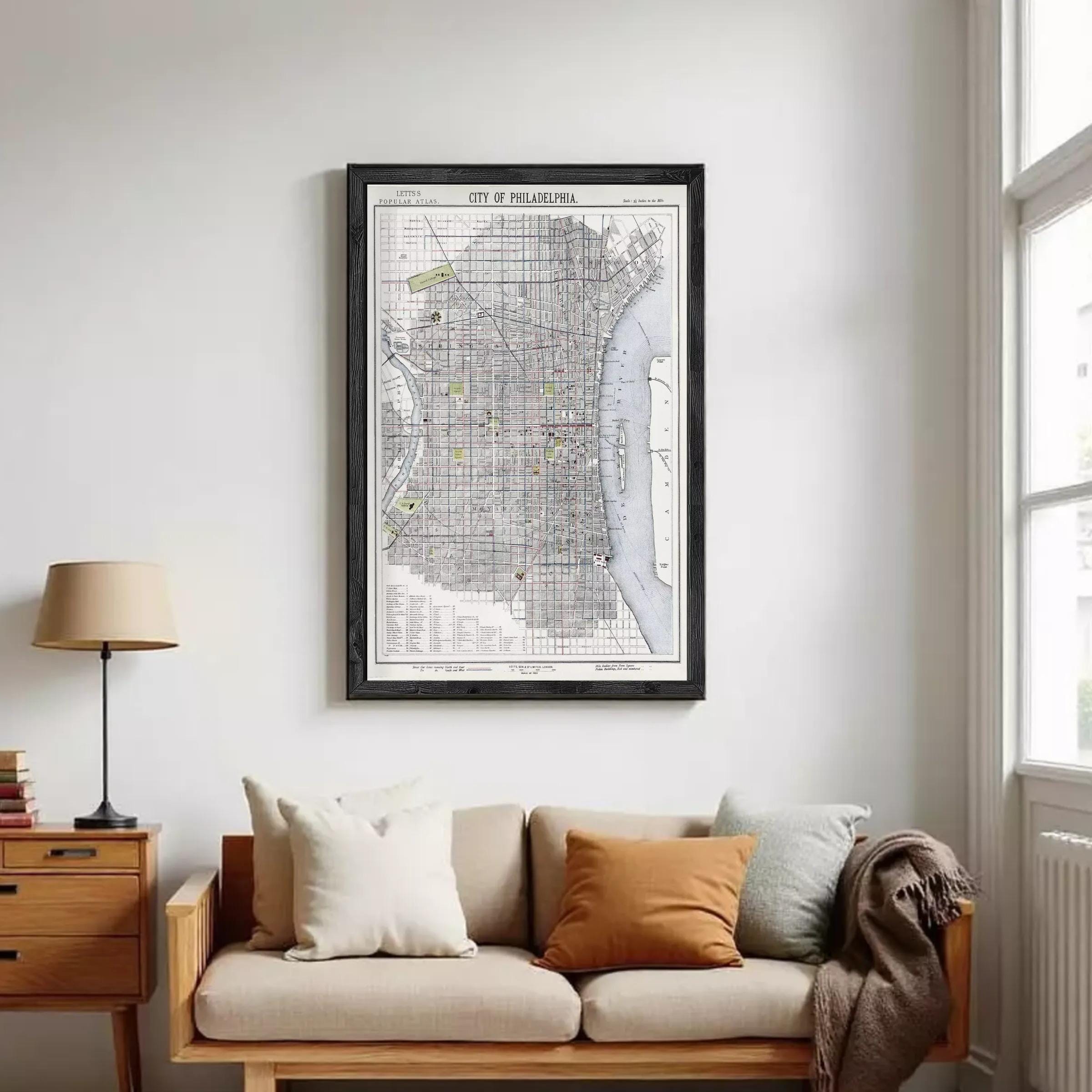 The image is a framed map of Philadelphia, Pennsylvania, depicting the city's streets, landmarks, and surrounding areas.