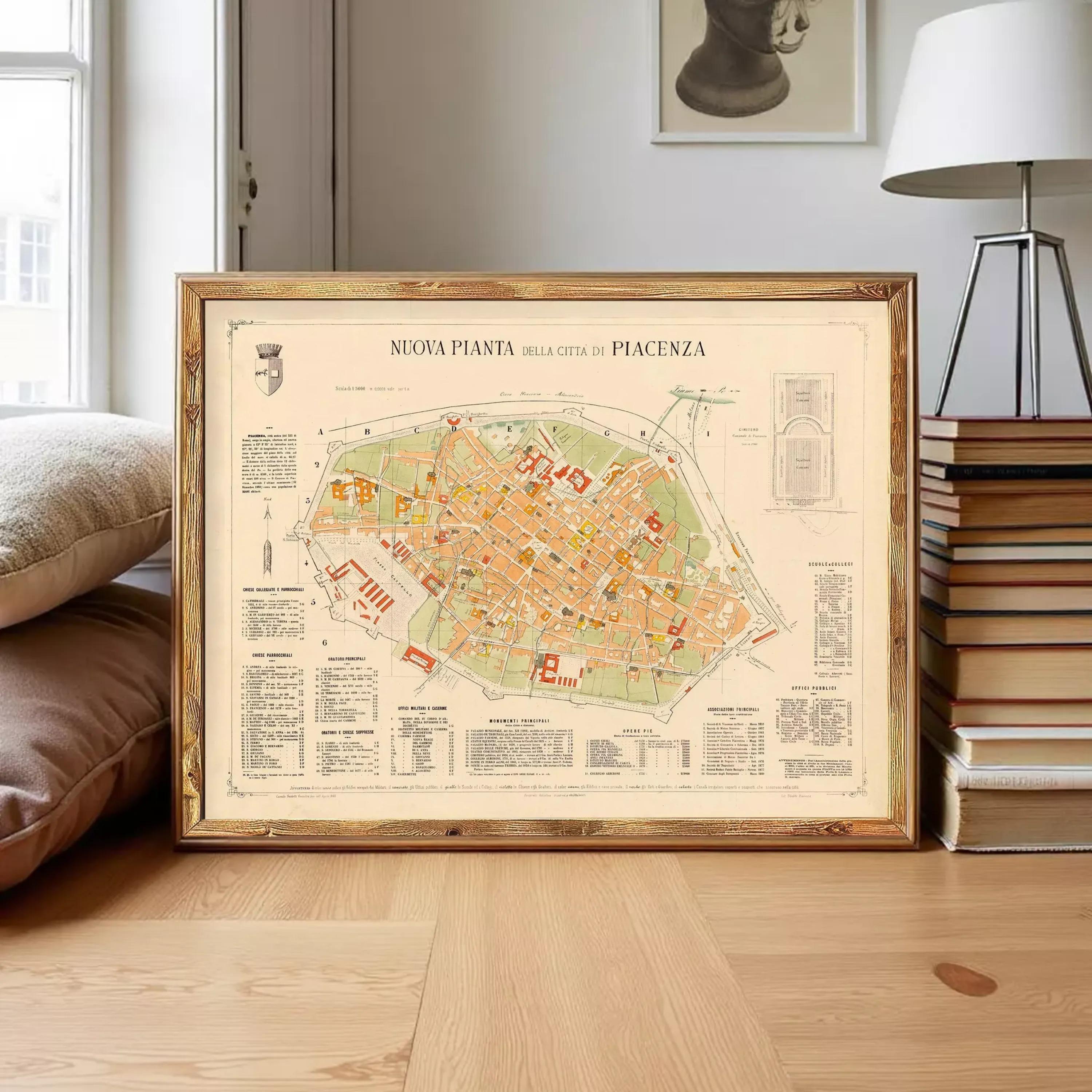 a framed map of the city of Piacenza, Italy, displayed on a wooden surface.