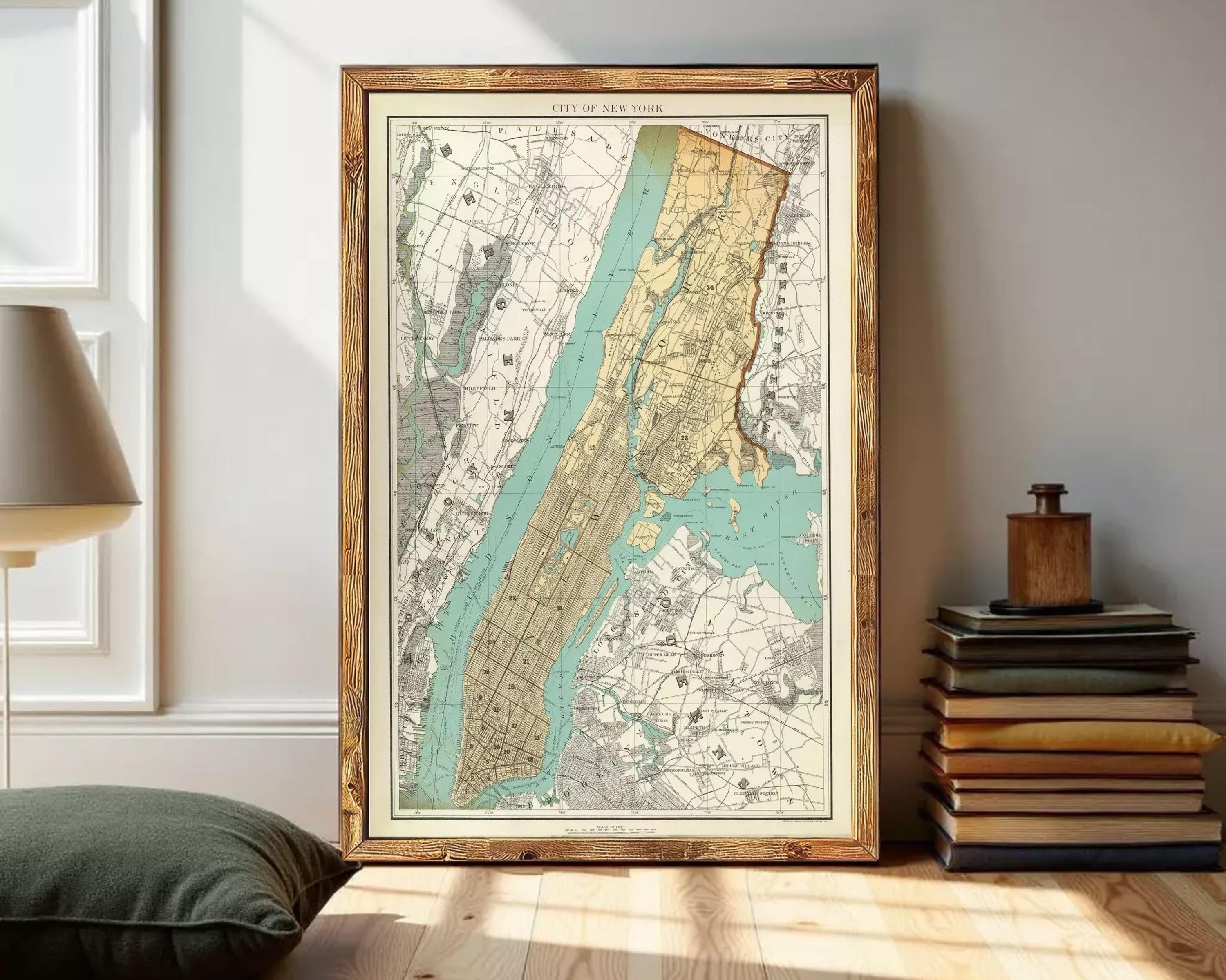 The image is a framed vintage map of New York City, depicting the city's streets and surrounding areas.