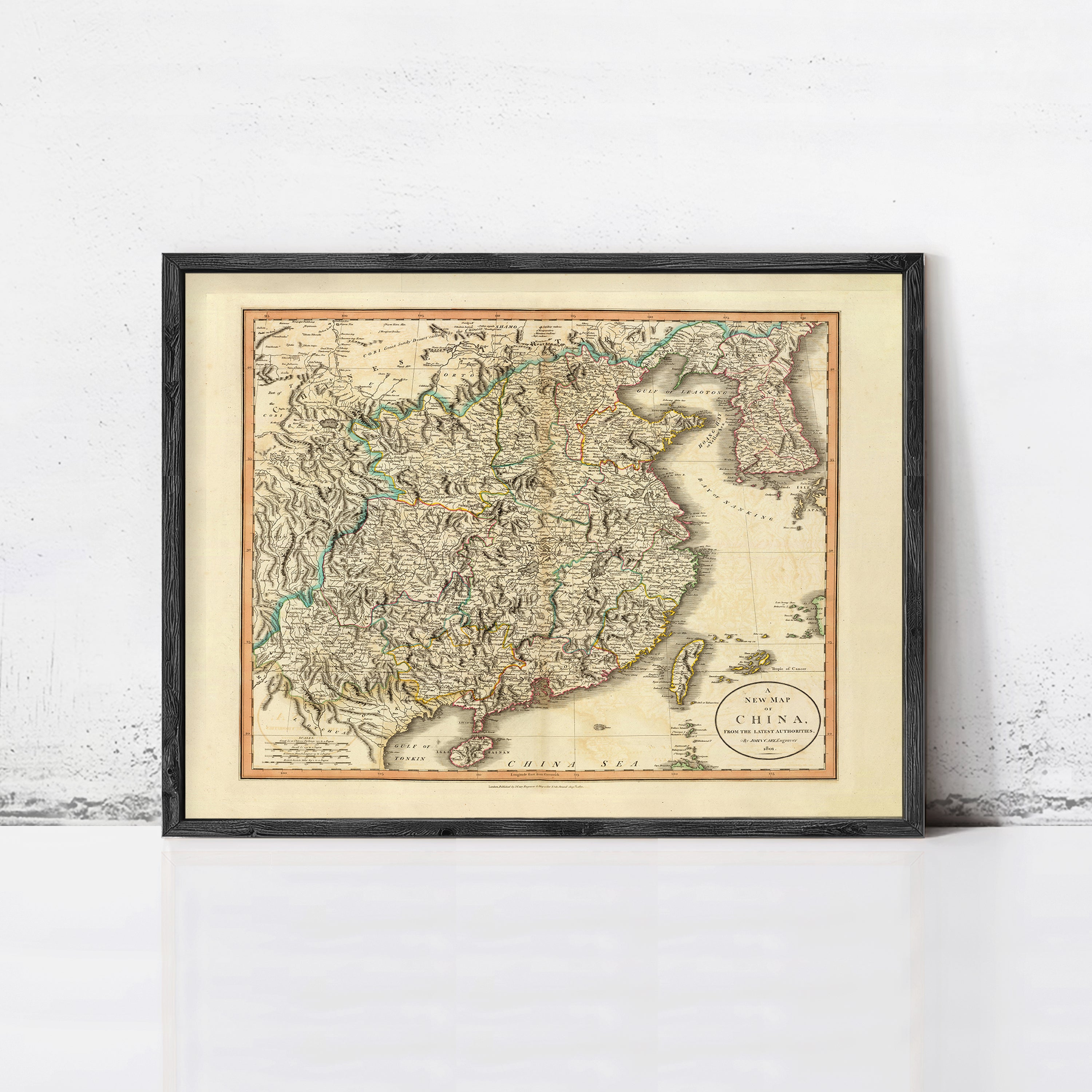 The image is a framed antique map of China, depicting the country's geographical layout and boundaries.