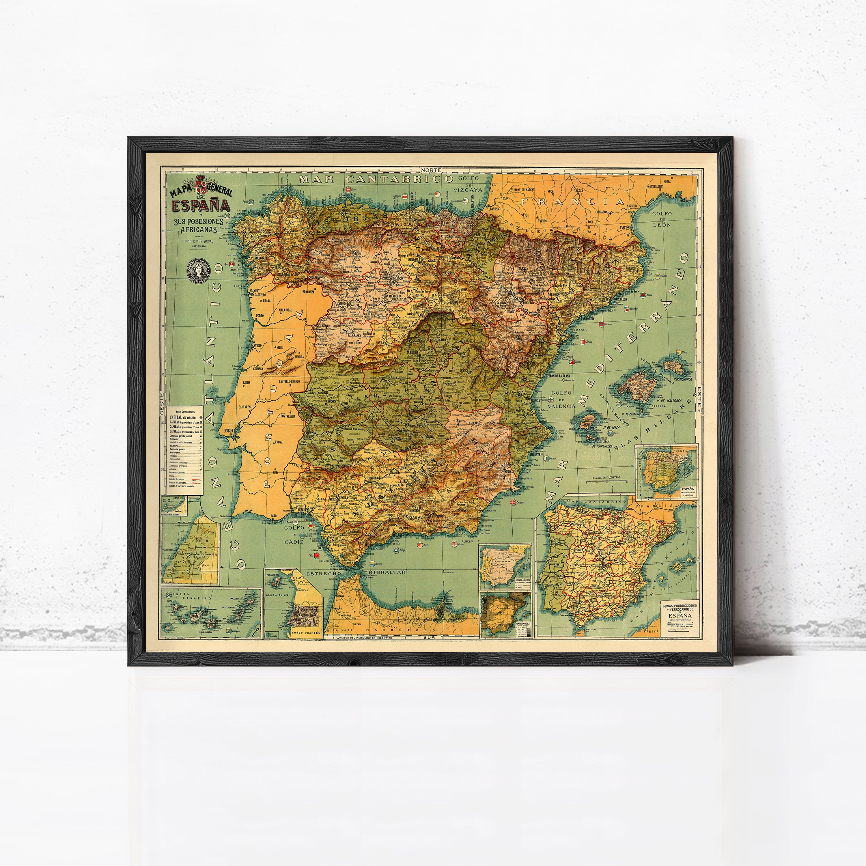 The image is a framed vintage map of Spain, showing the country's geographical layout and surrounding areas.