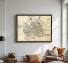 The image is a framed map of Florence, Italy, depicting the city's layout and surrounding areas.