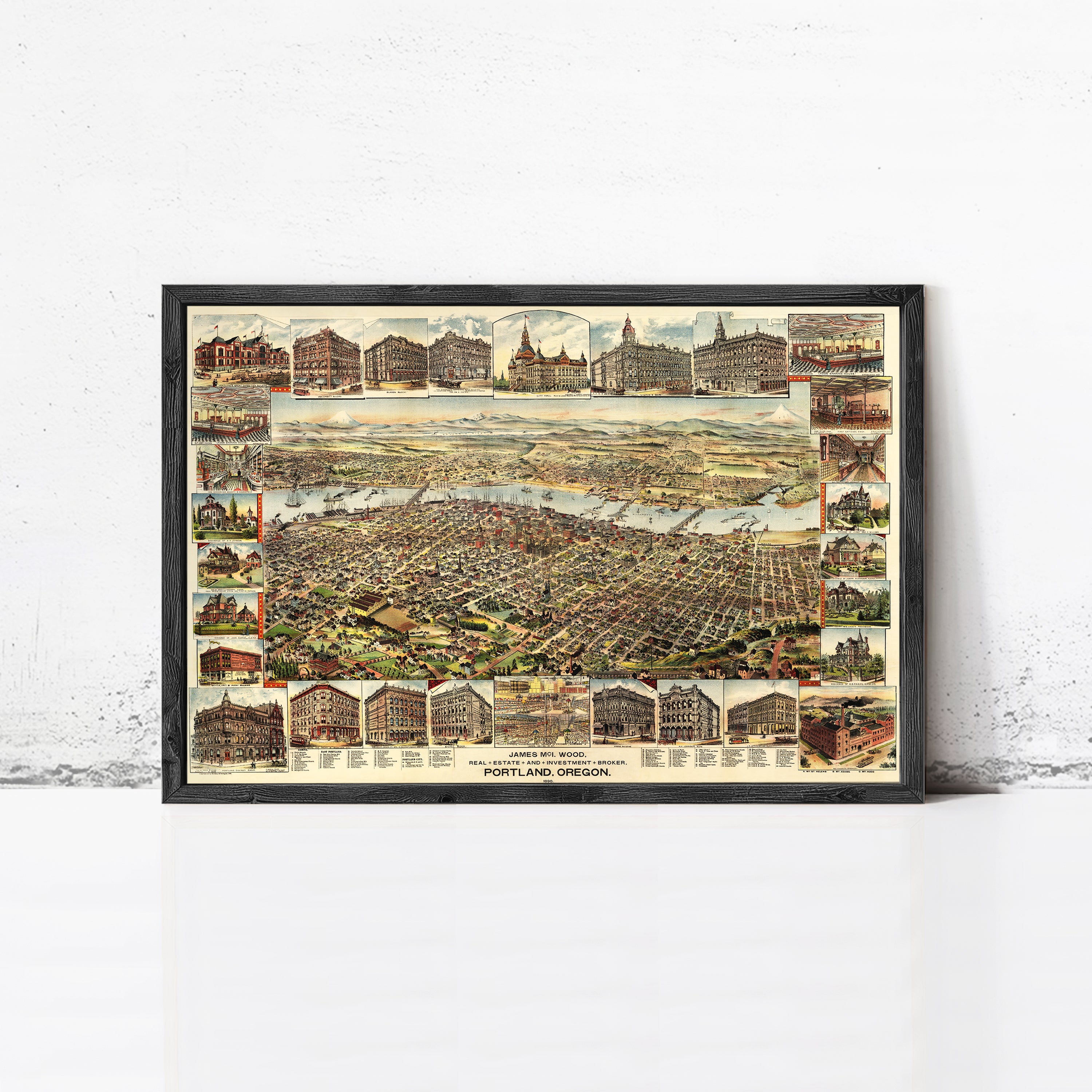 The image is a framed vintage map of Portland, Oregon, depicting various buildings and landmarks in the city.