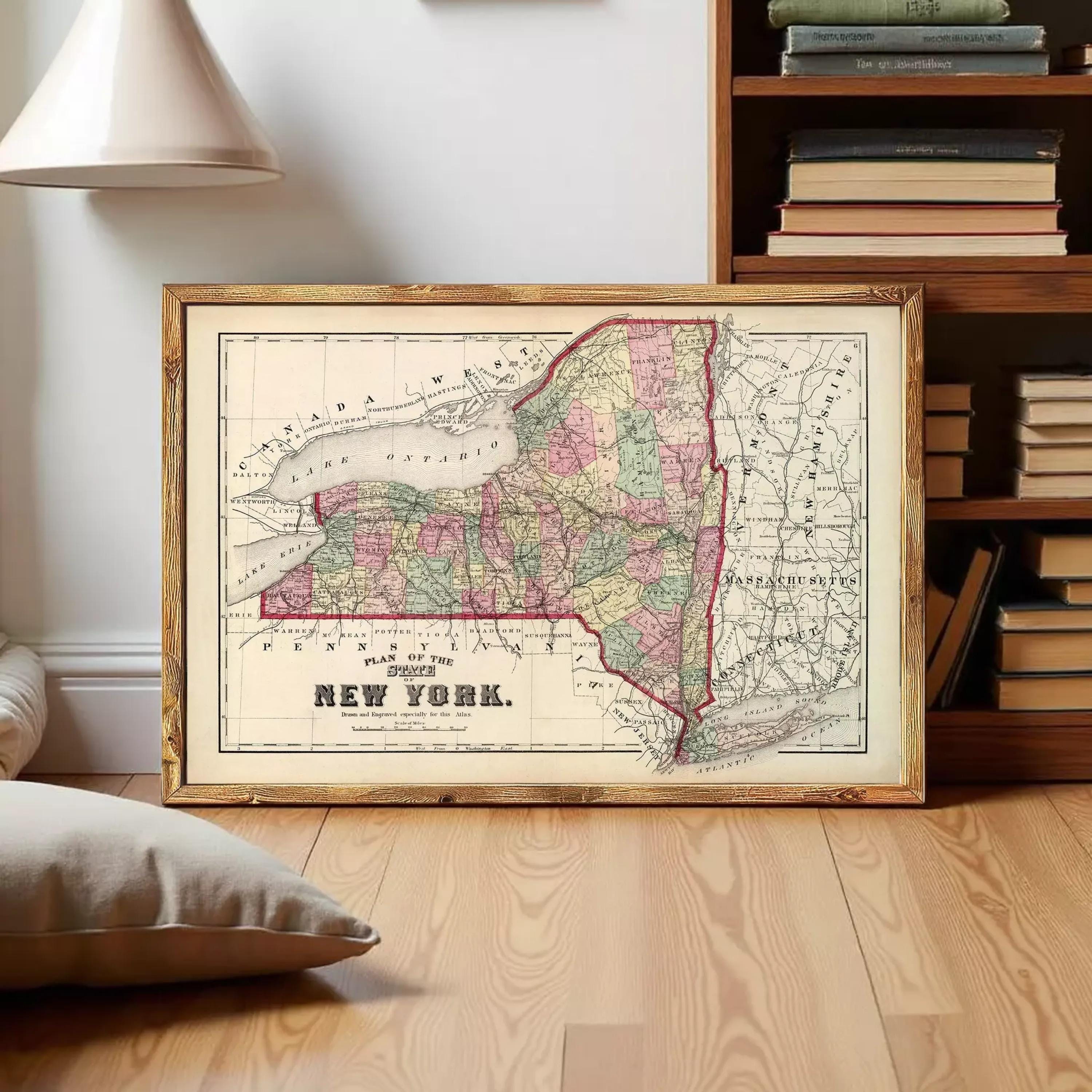 A framed map of New York State, depicting the state's geographical layout and surrounding areas.