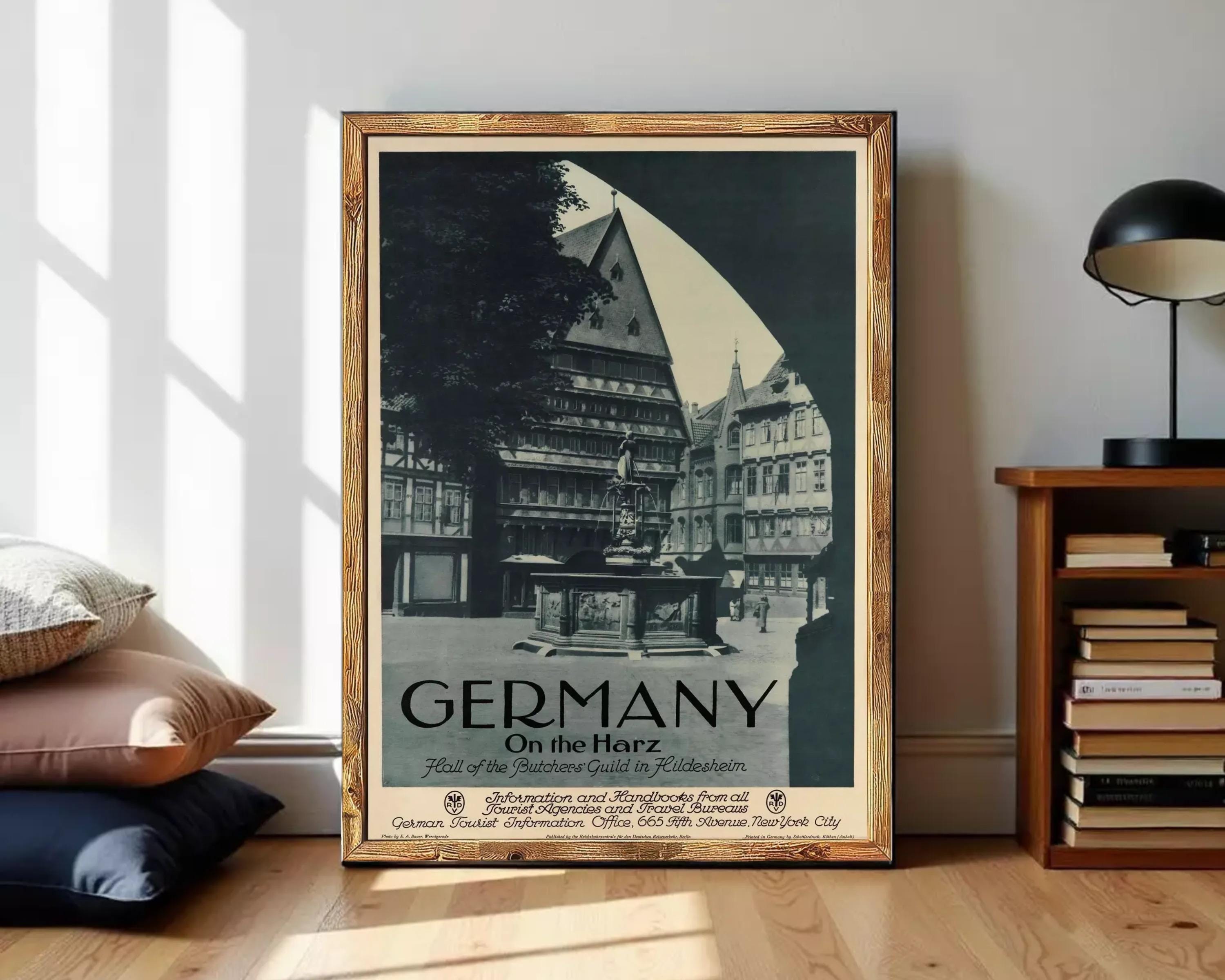 The image is a framed vintage poster of a German town, featuring a large building with a dome and a fountain in the foreground.