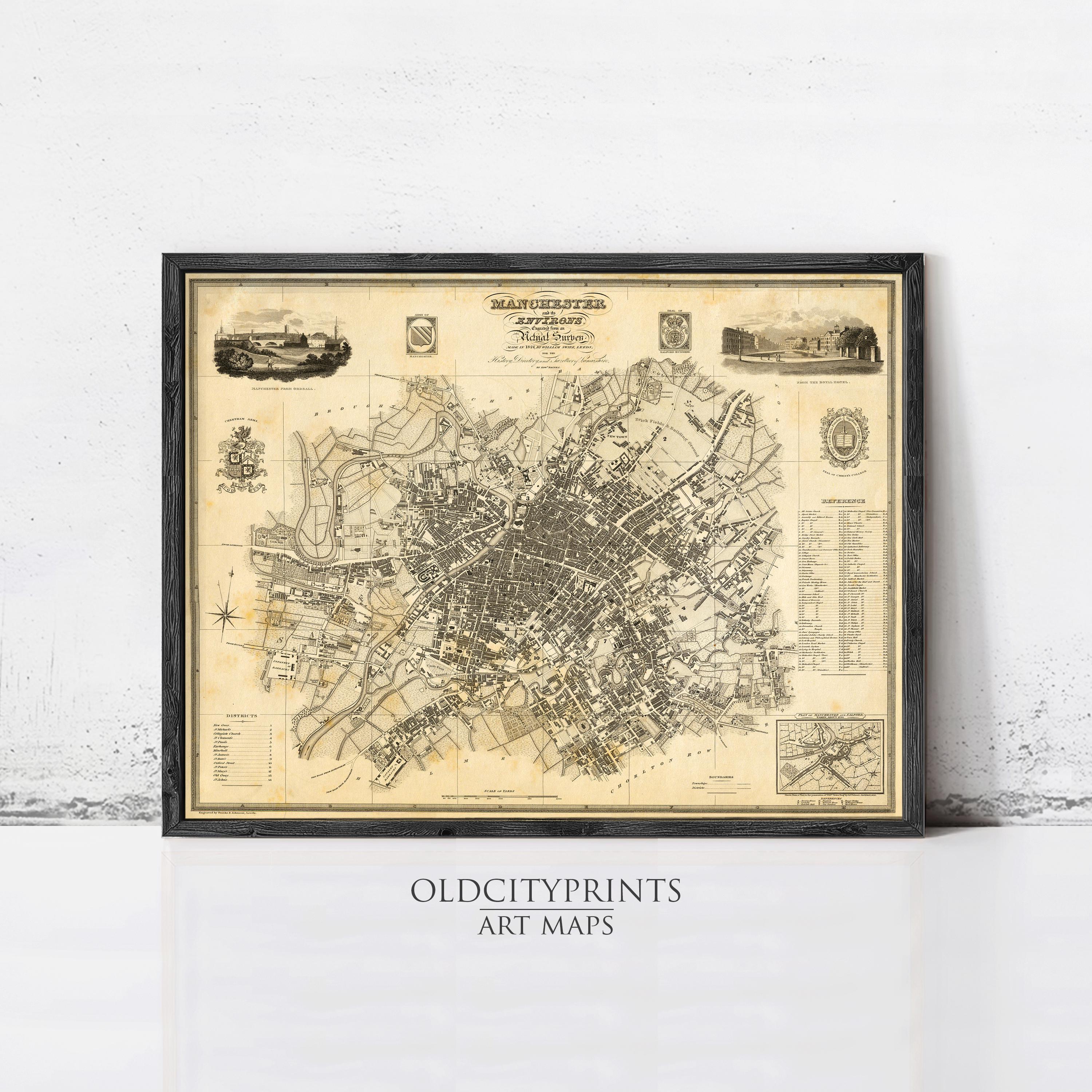 The image is a framed antique map of Manchester, England, dating back to the 19th century.